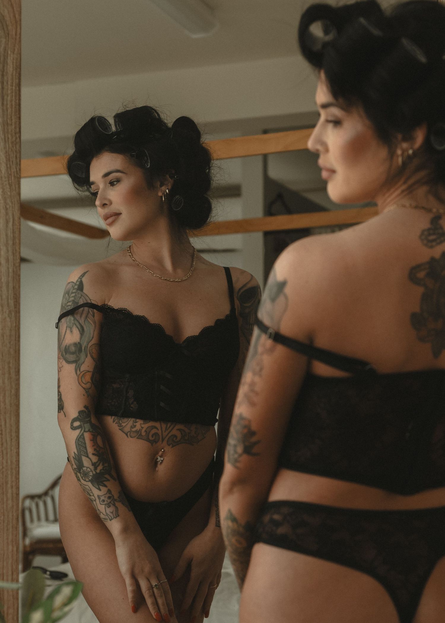 local Sudbury Boudoir expert provides boudoir photoshoot experience in black lingerie in studio