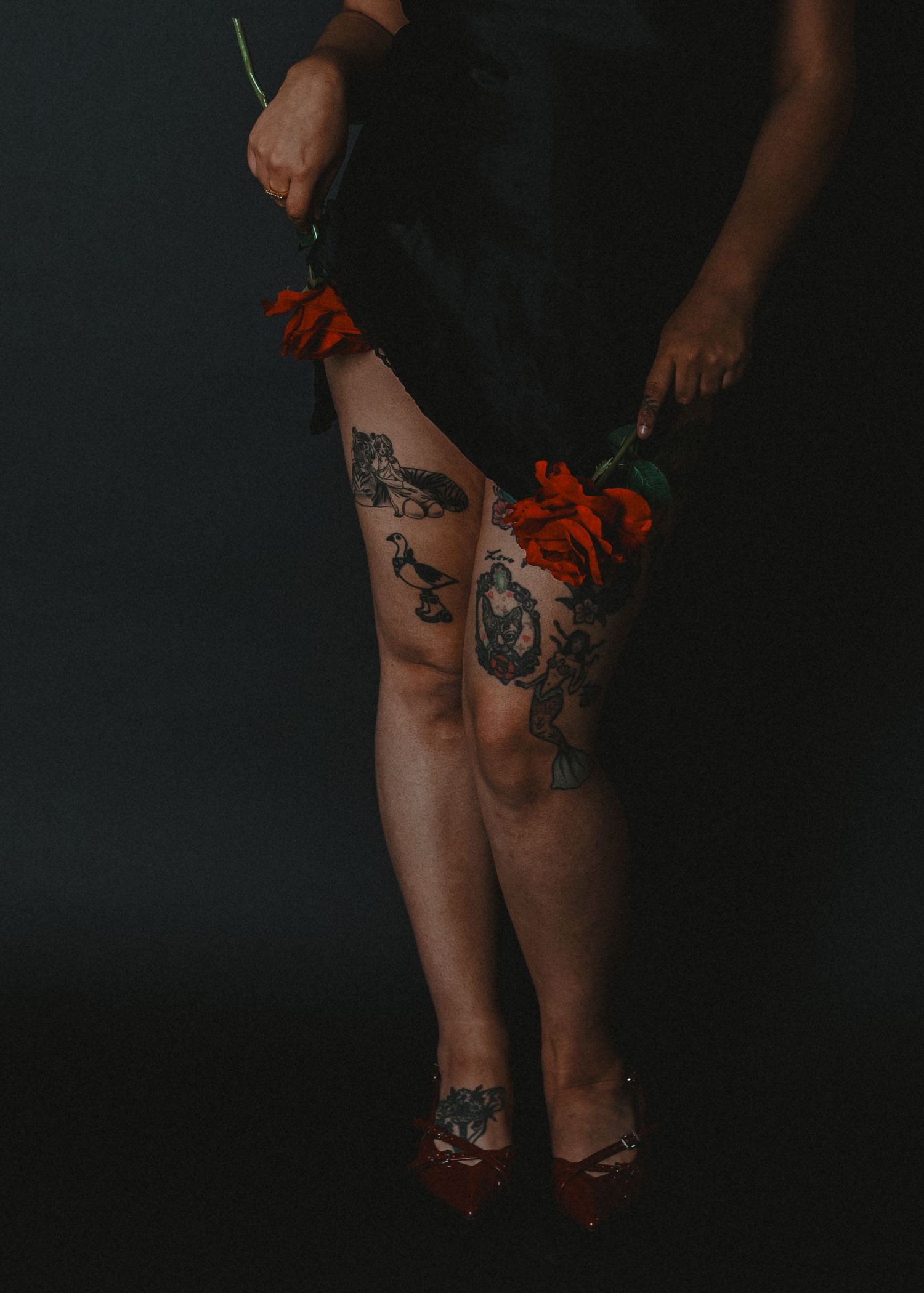 local Sudbury Ontario Boudoir expert photographer provides burlesque boudoir experience to model in black dress