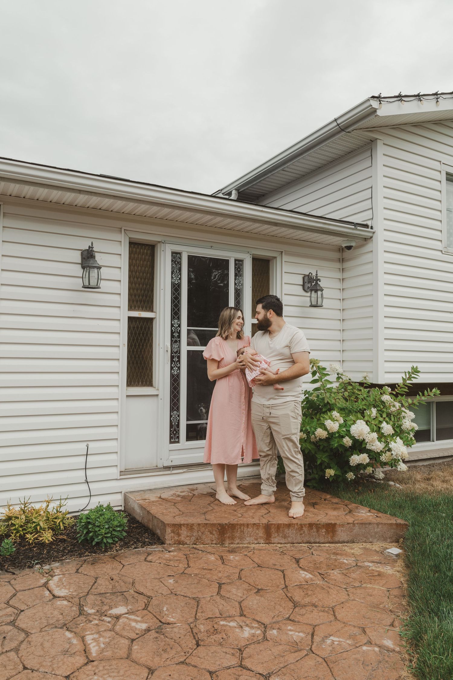 Nostalgic film-style image of couple embracing outdoors in Sudbury