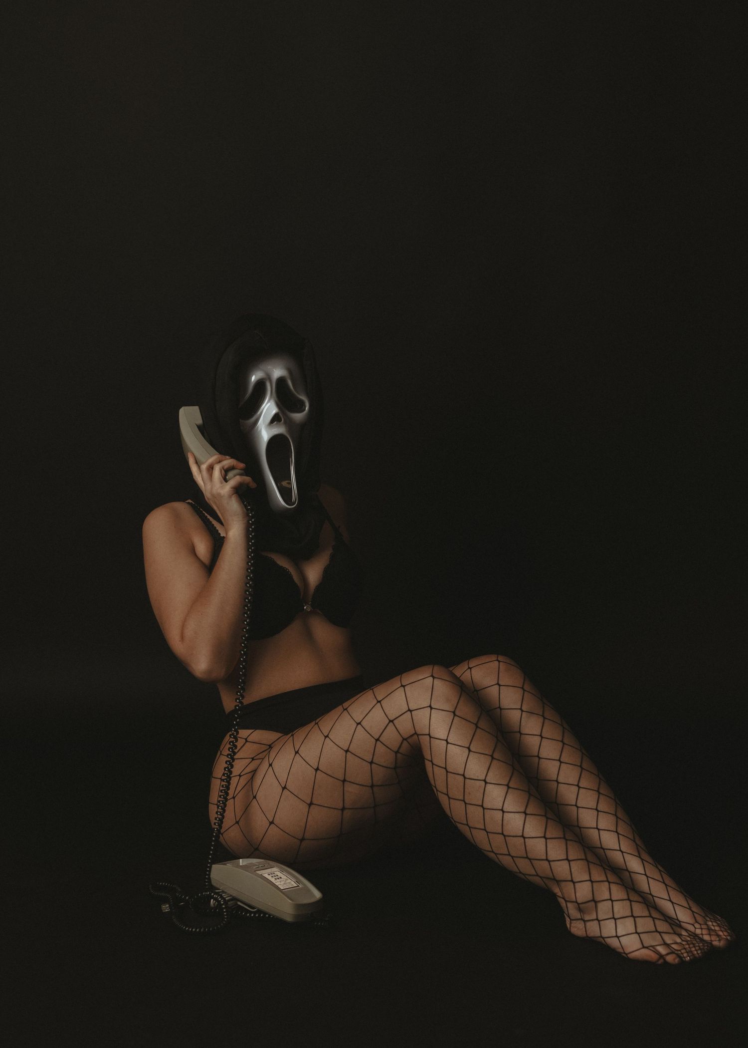 local Sudbury Boudoir expert provides boudoir photoshoot experience in black lingerie in studio halloween