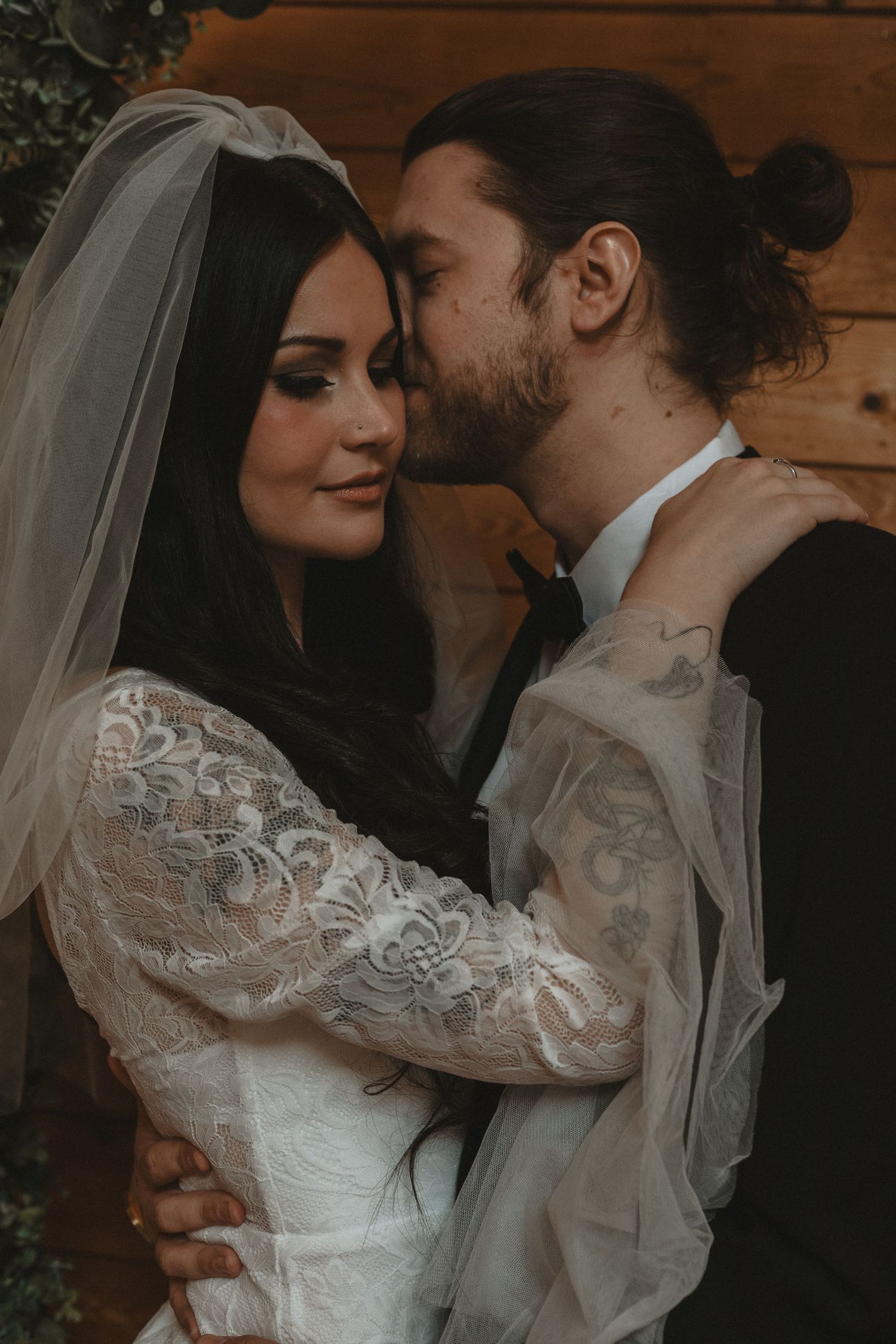 Local Sudbury Wedding Photographer captures bride and groom on wedding day in Sudbury ontario big kiss