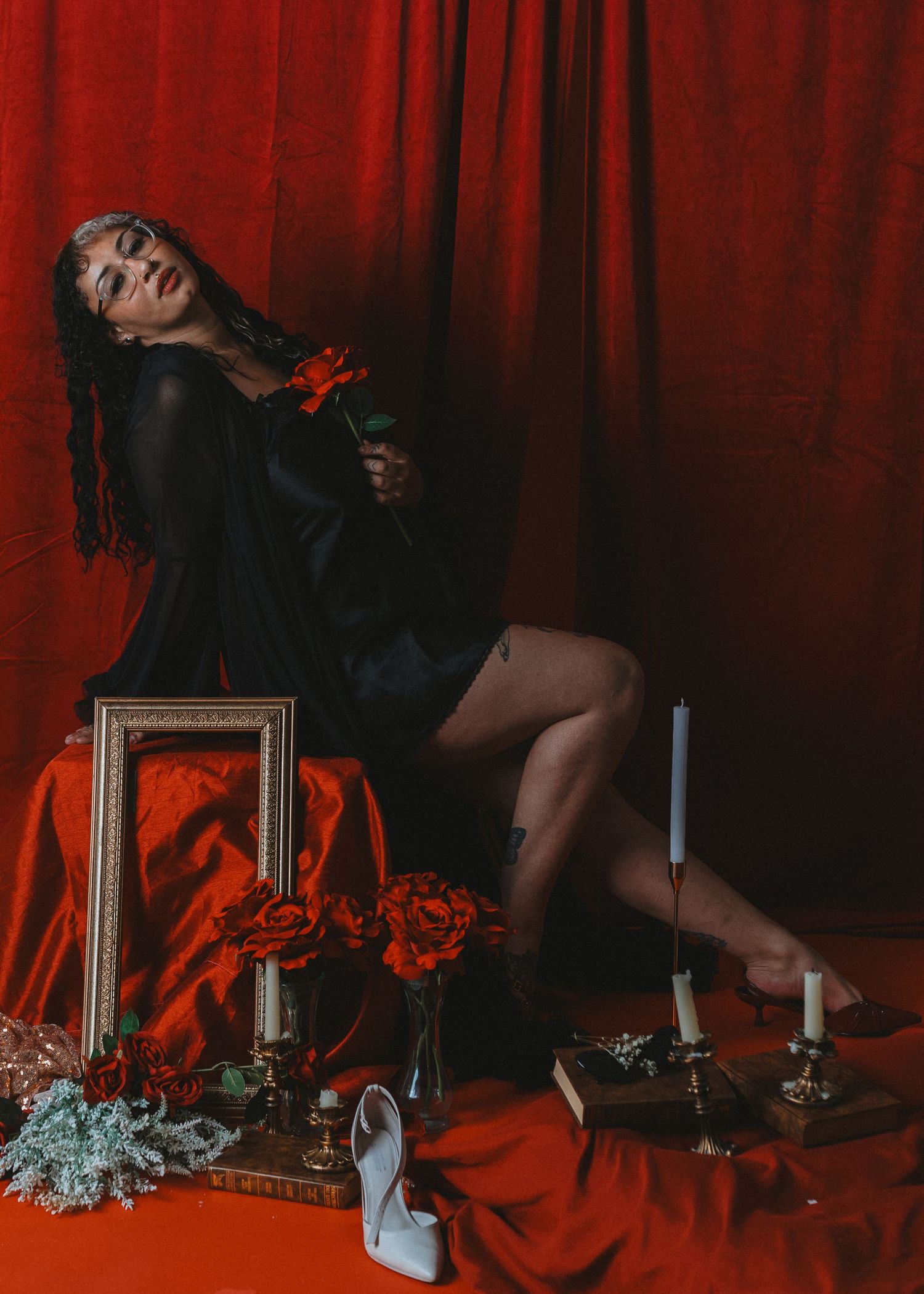 local Sudbury Ontario Boudoir expert photographer provides burlesque boudoir experience to model in black dress