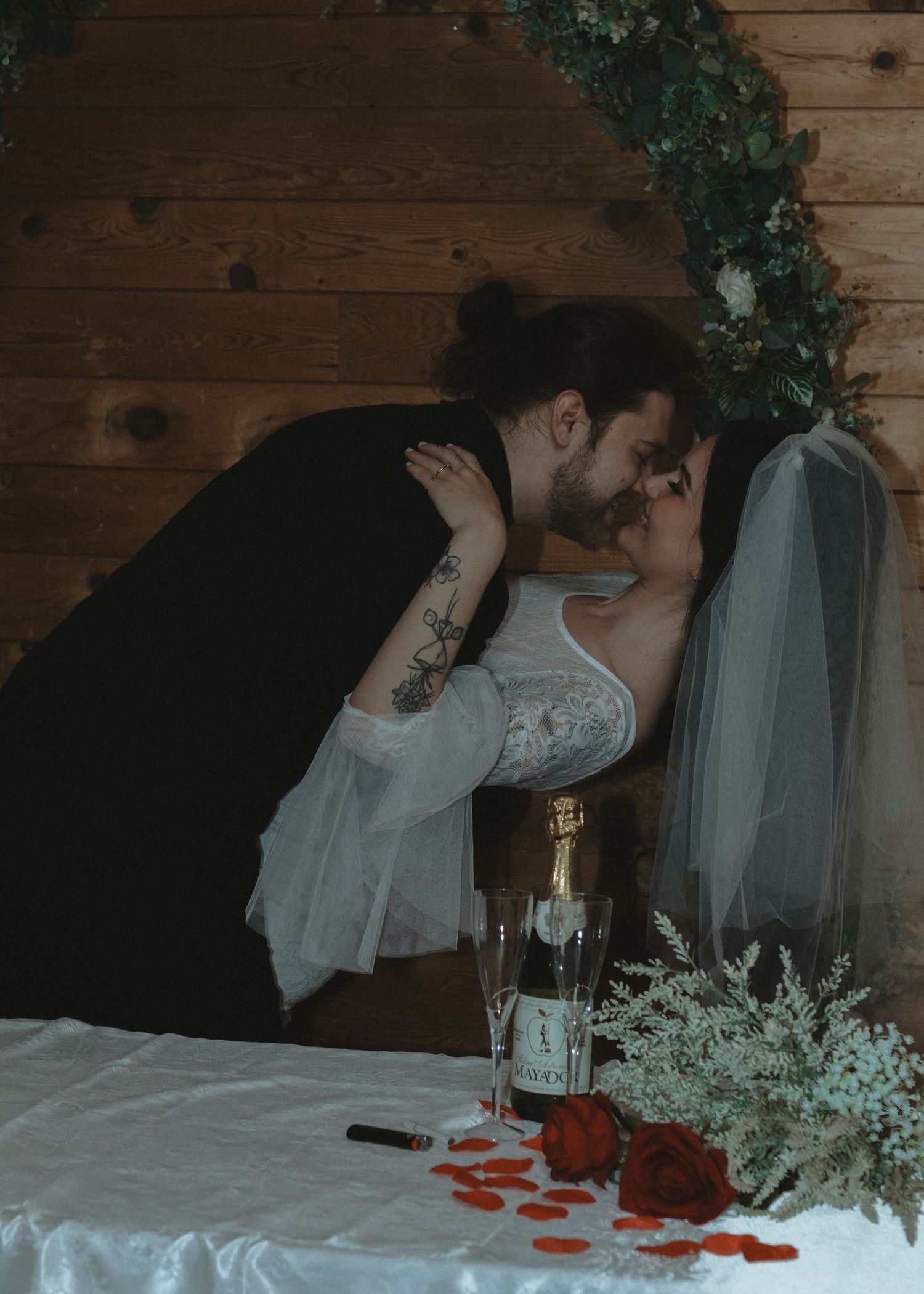 Local Sudbury Wedding Photographer near me captures bride and groom on wedding day in Sudbury ontario big kiss