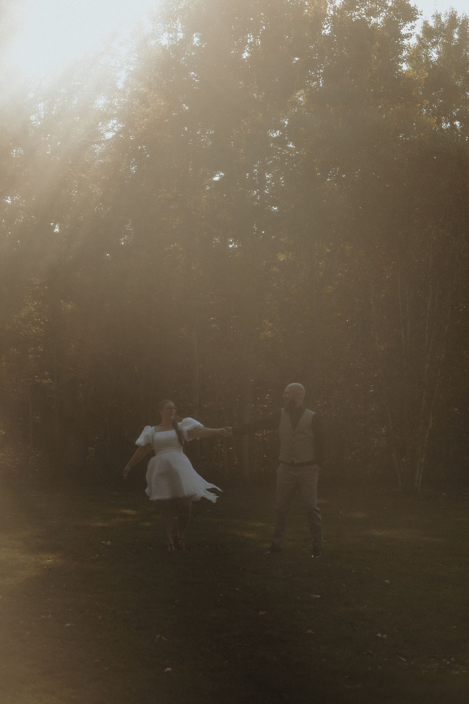 Local Sudbury Ontario Wedding Photographer captures bride and groom on wedding day in Sudbury ontario dancing having fun