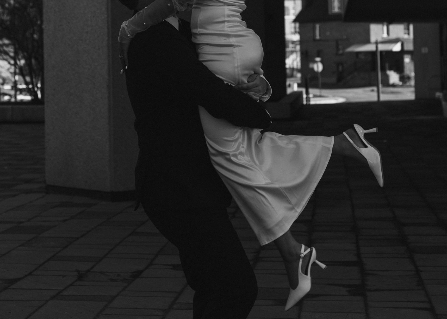 cinematic moment groom picking up bride in Sudbury