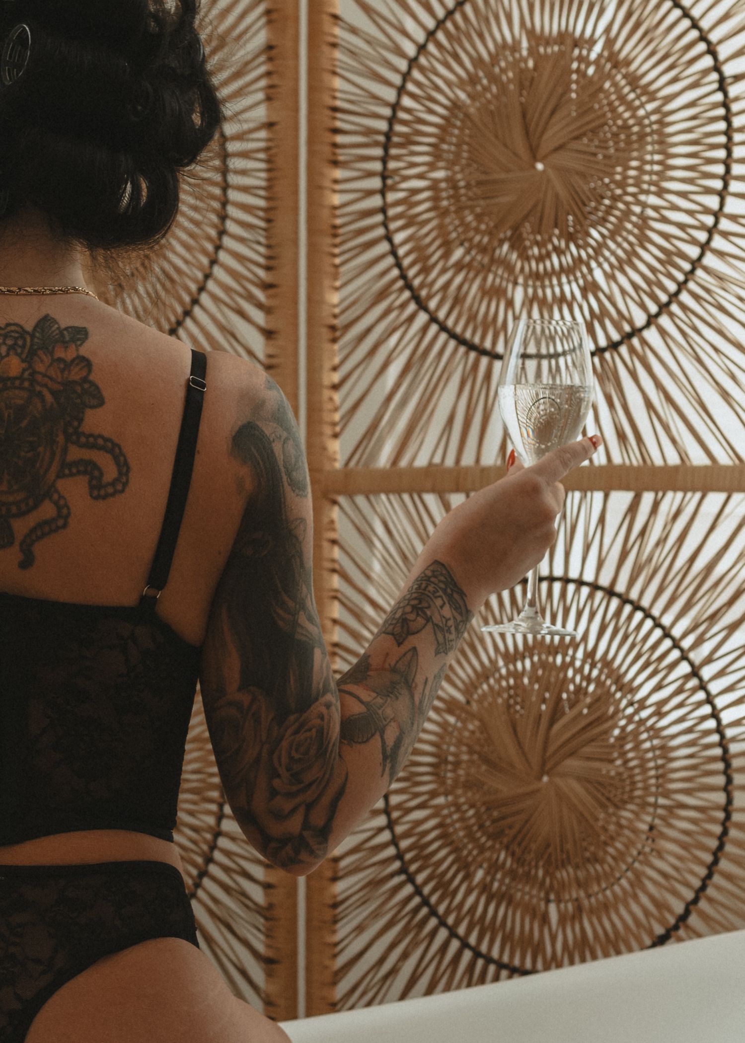 local Sudbury Boudoir expert provides boudoir photoshoot experience in black lingerie in studio