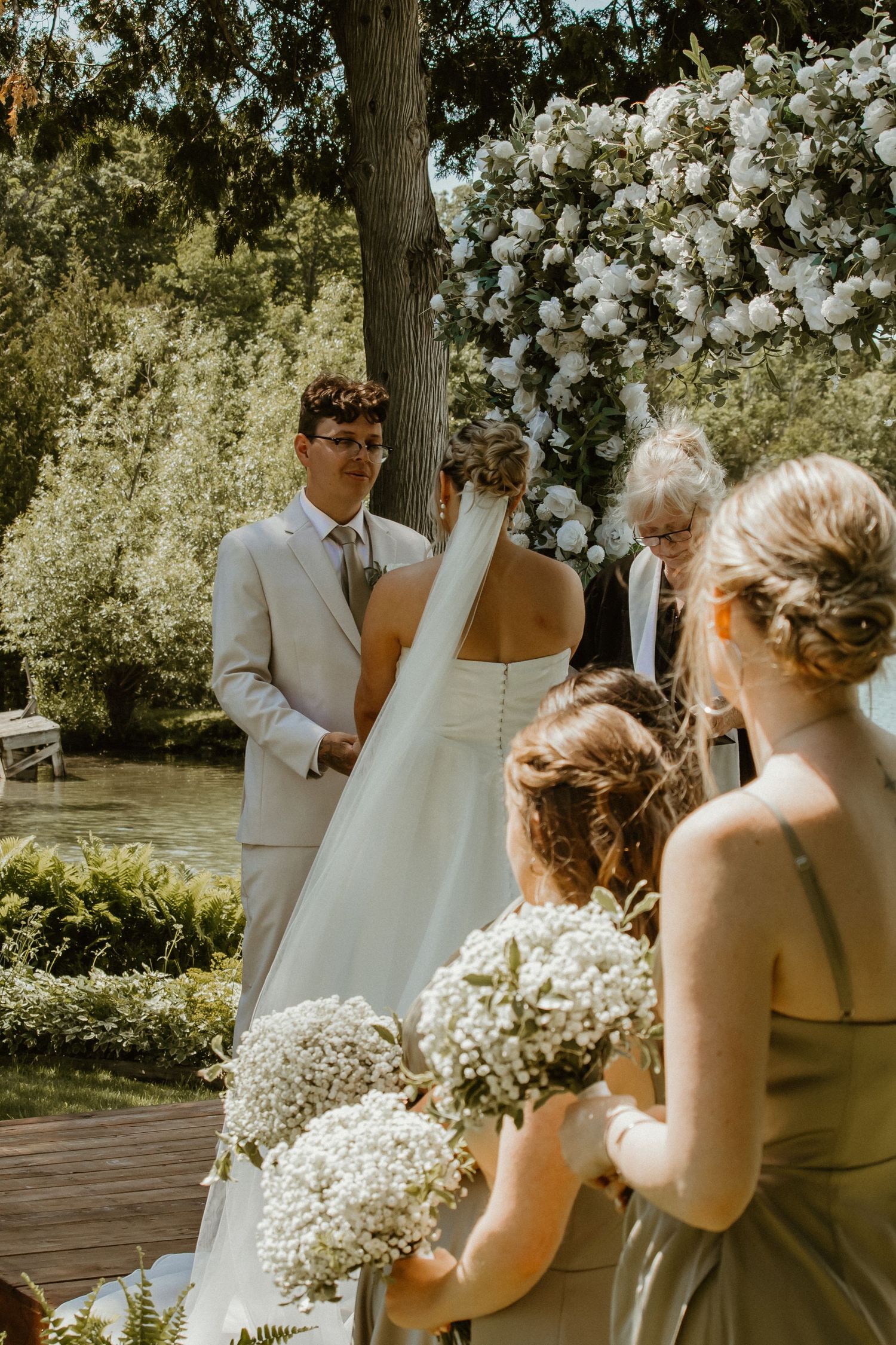 Local Sudbury Wedding Photographer captures bride and groom on wedding day big kiss at altar