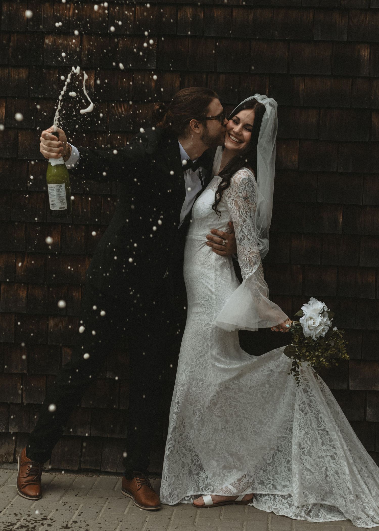 Local Sudbury Wedding Photographer captures bride and groom on wedding day in Sudbury ontario big kiss