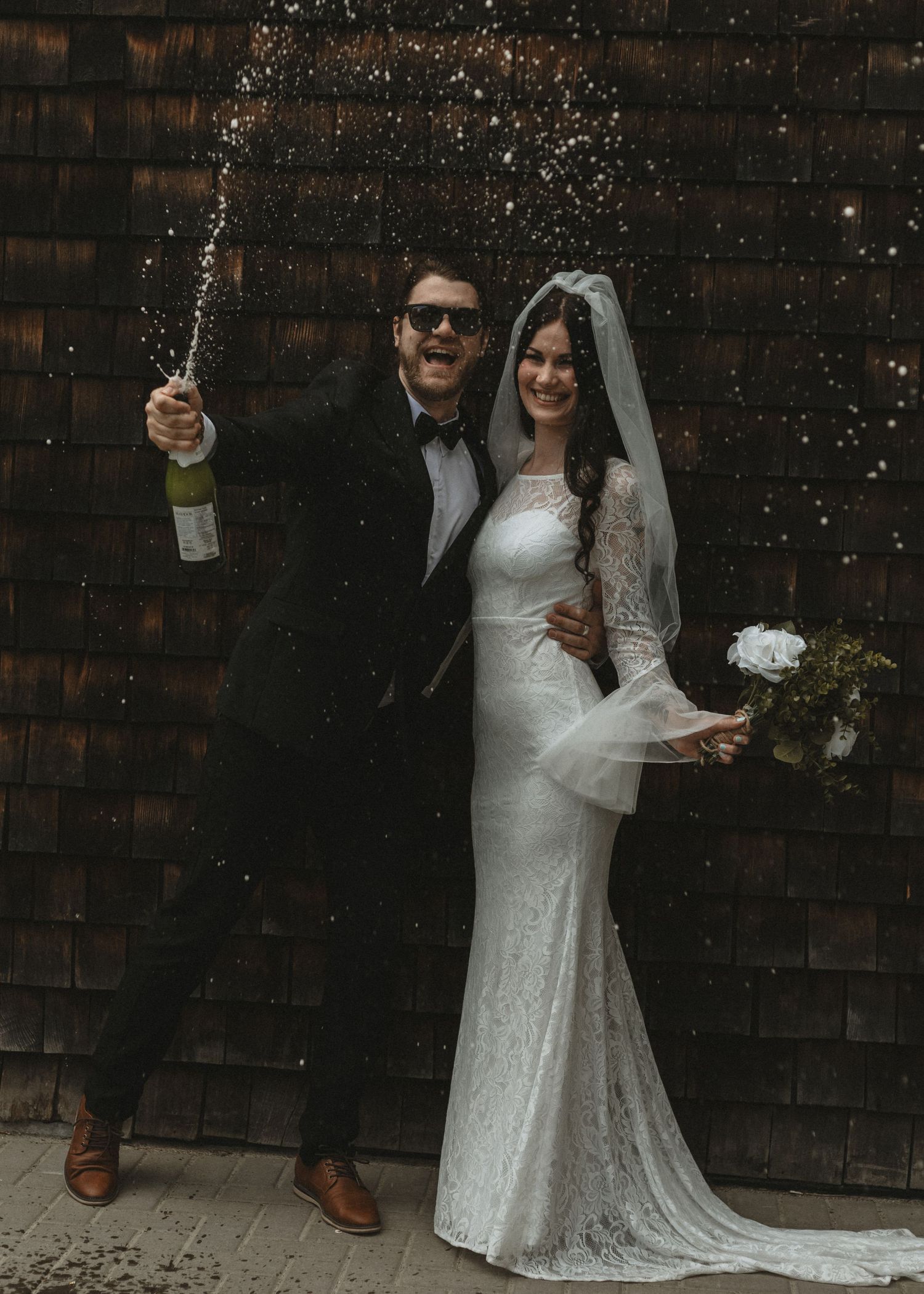 Local Sudbury Wedding Photographer near me  captures bride and groom on wedding day in Sudbury ontario champagne toast