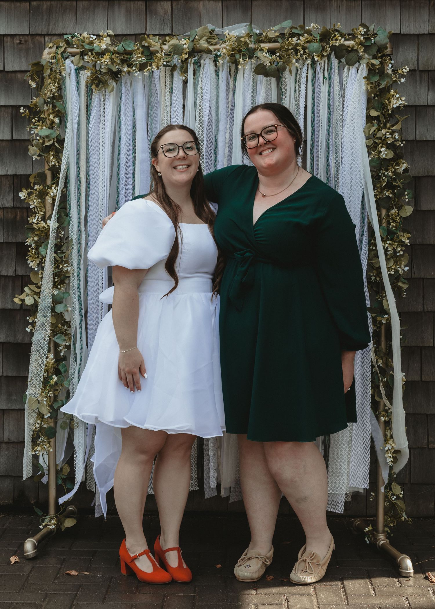 Local Sudbury Ontario Wedding Photographer captures bride and friend on wedding day in Sudbury ontario dancing having fun