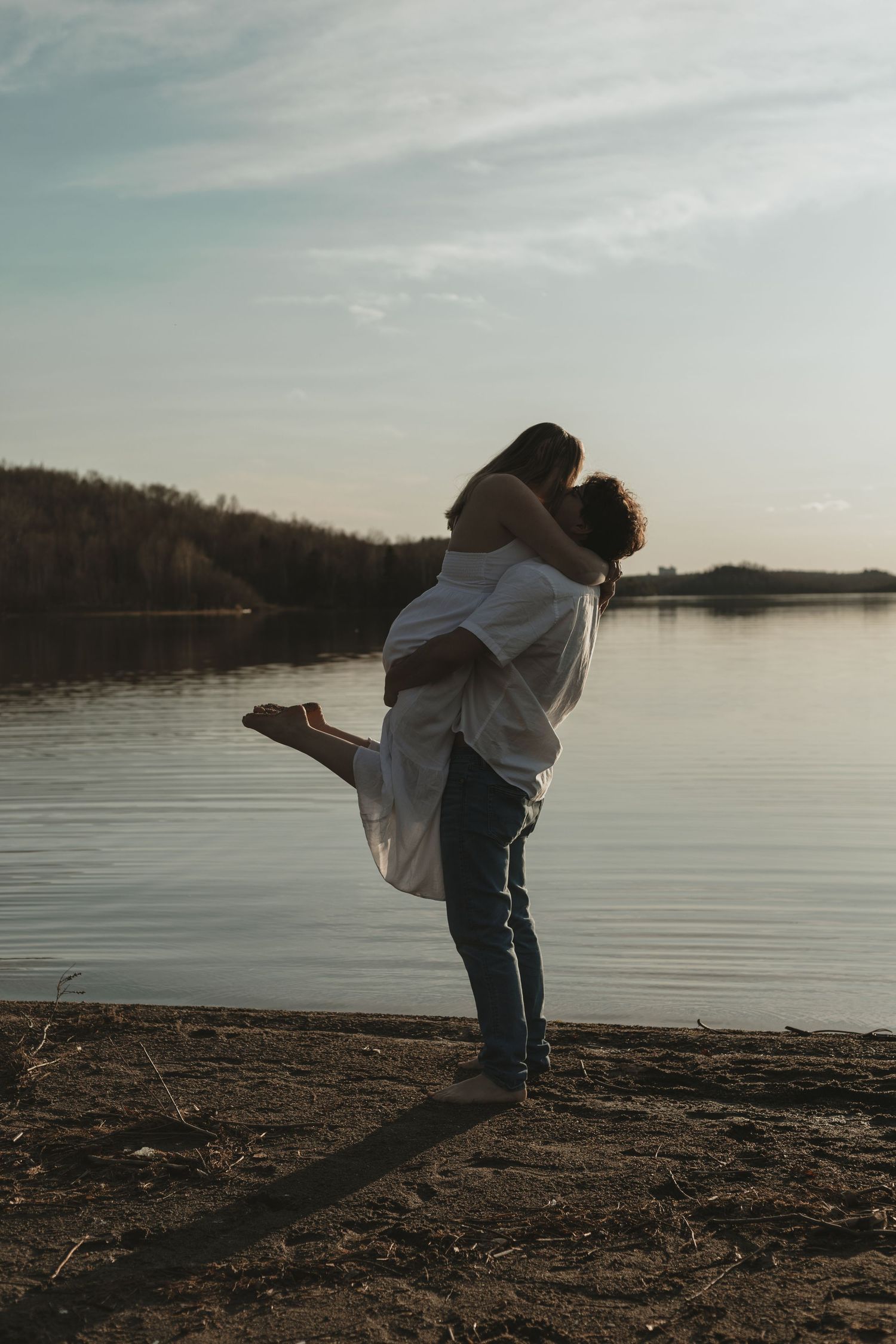 Sudbury engagement photographer specializing in natural light photography of couple enjoying a moment at the beach