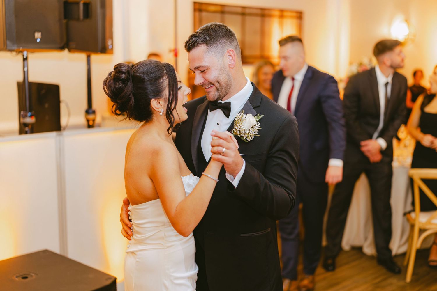 Couple shares an intimate first dance at their elegant wedding reception.