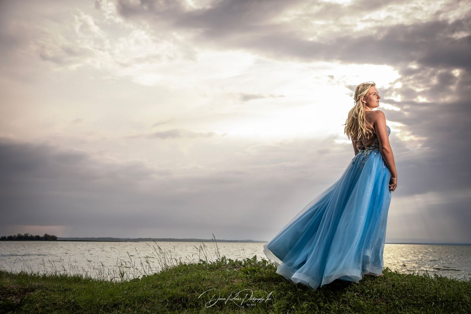 blue dress on grass hill
