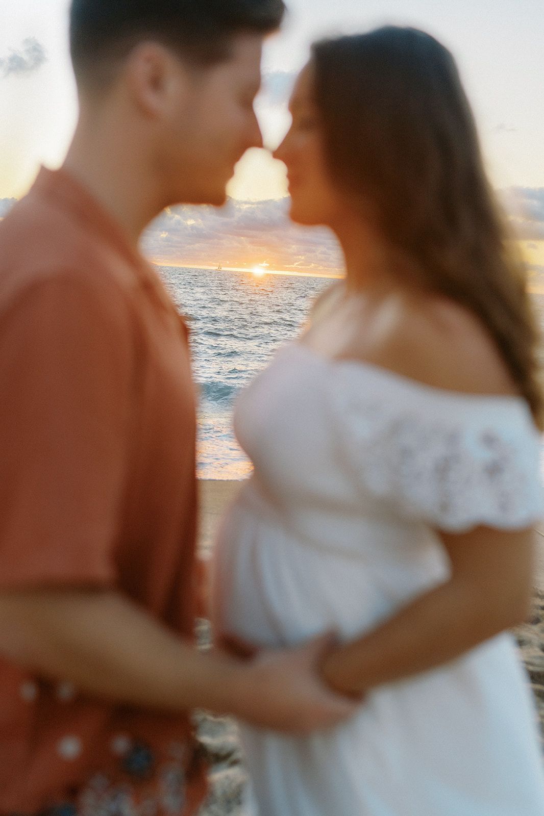Couple sharing a romantic sunset kiss by the ocean, in Puerto Vallarta — Marina Pochepkina Photography