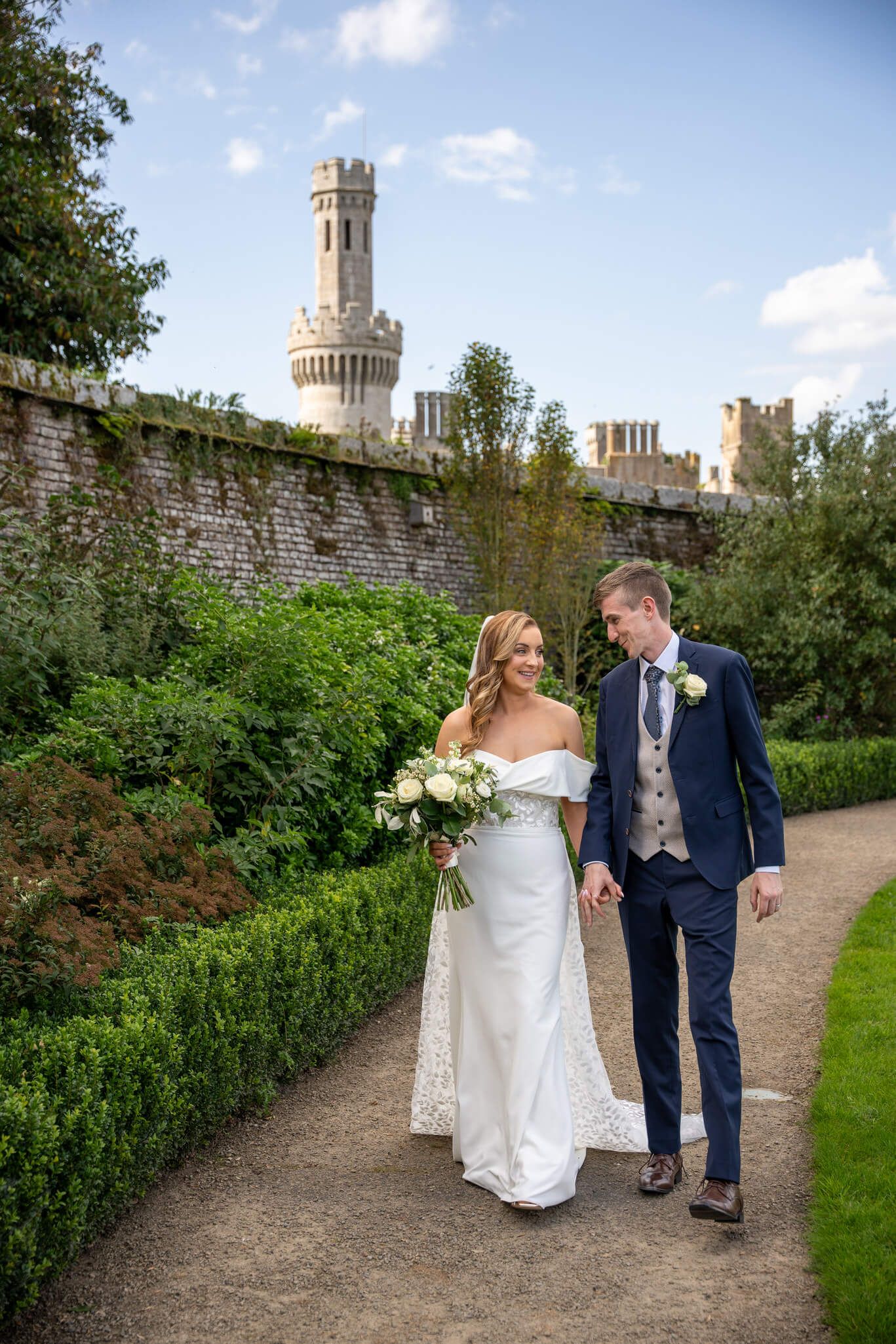 Bride and groom walking through Ducketts Grove, County Carlow photo by AK wedding photography and videography.
