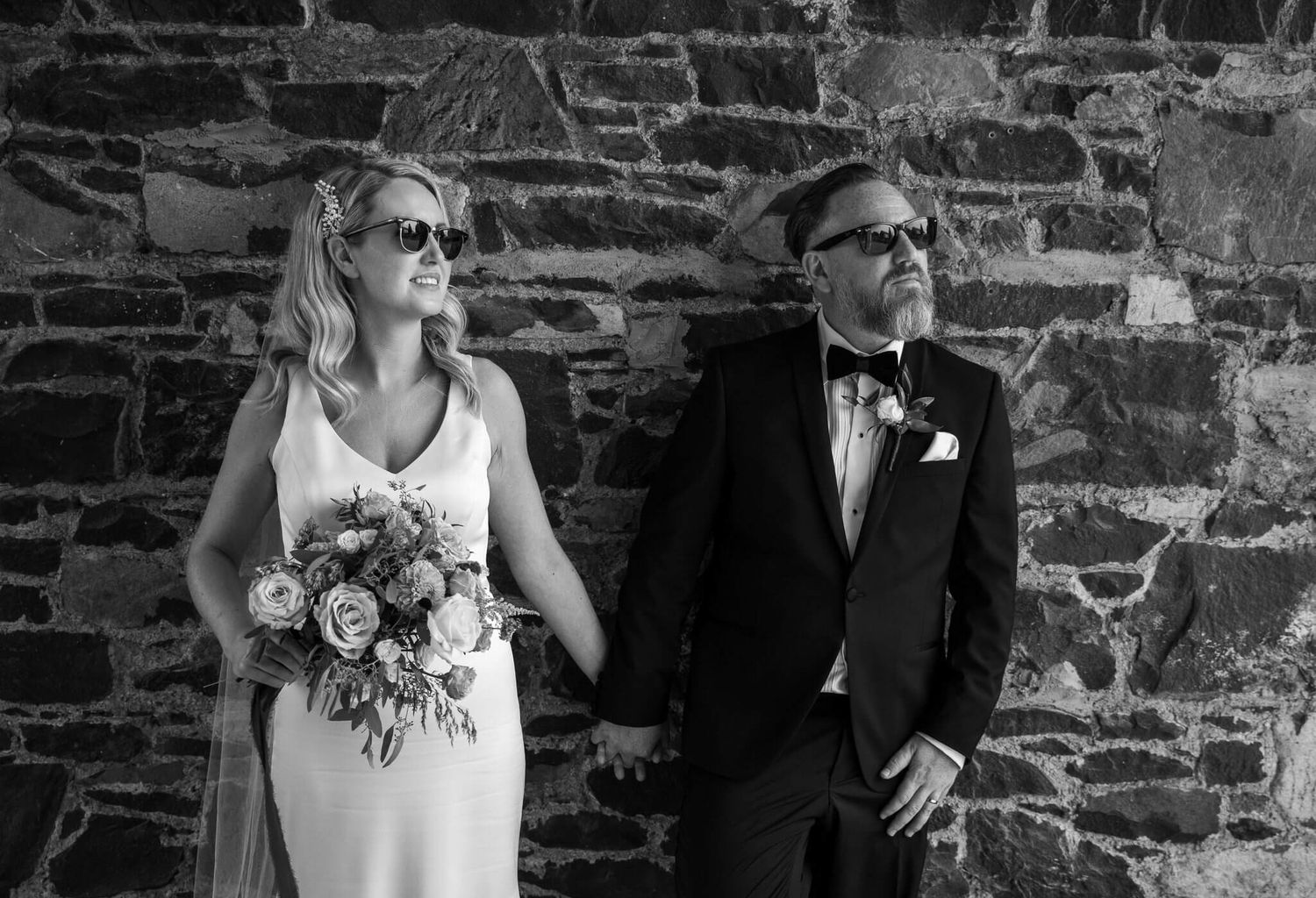 Black and white photo of a bride and groom in sunglasses at Virginia park lodge, Cavan photo by AK wedding photography and videography.