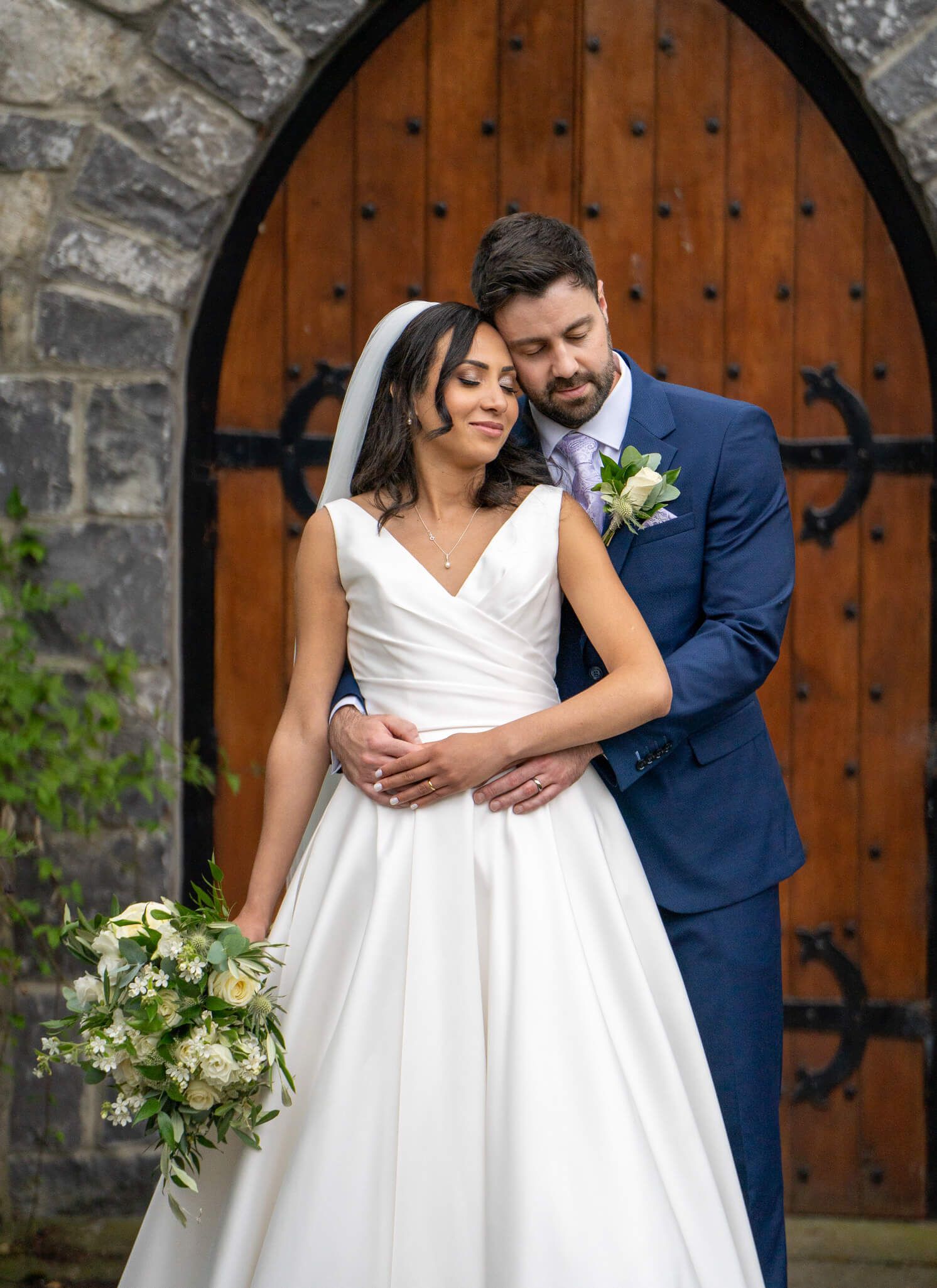 Bride and groom embrace at Barberstown castle photo by AK wedding photography and videography.