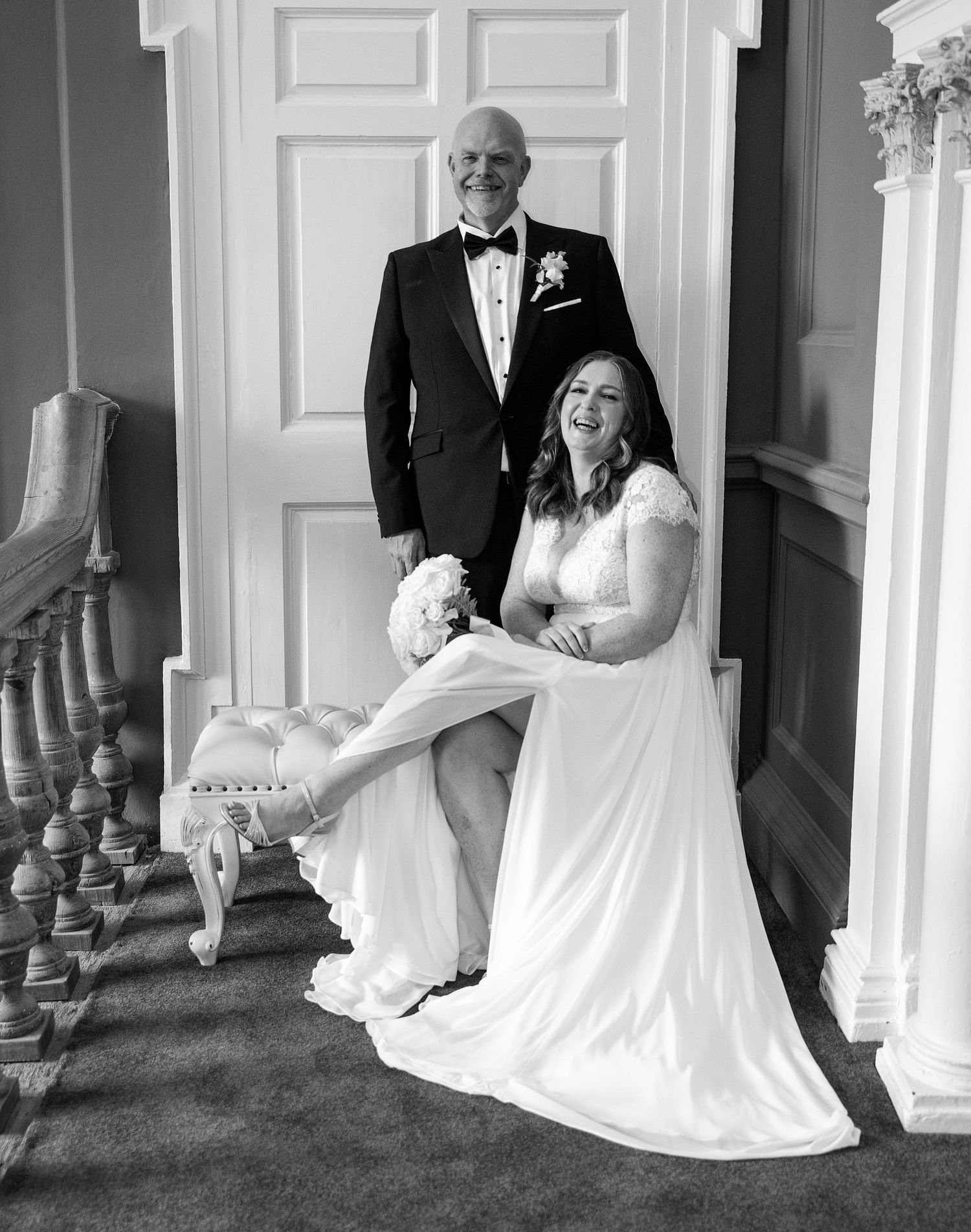 Black and white wedding photo of a laughing bride at the stunning venue at Bellinter house.