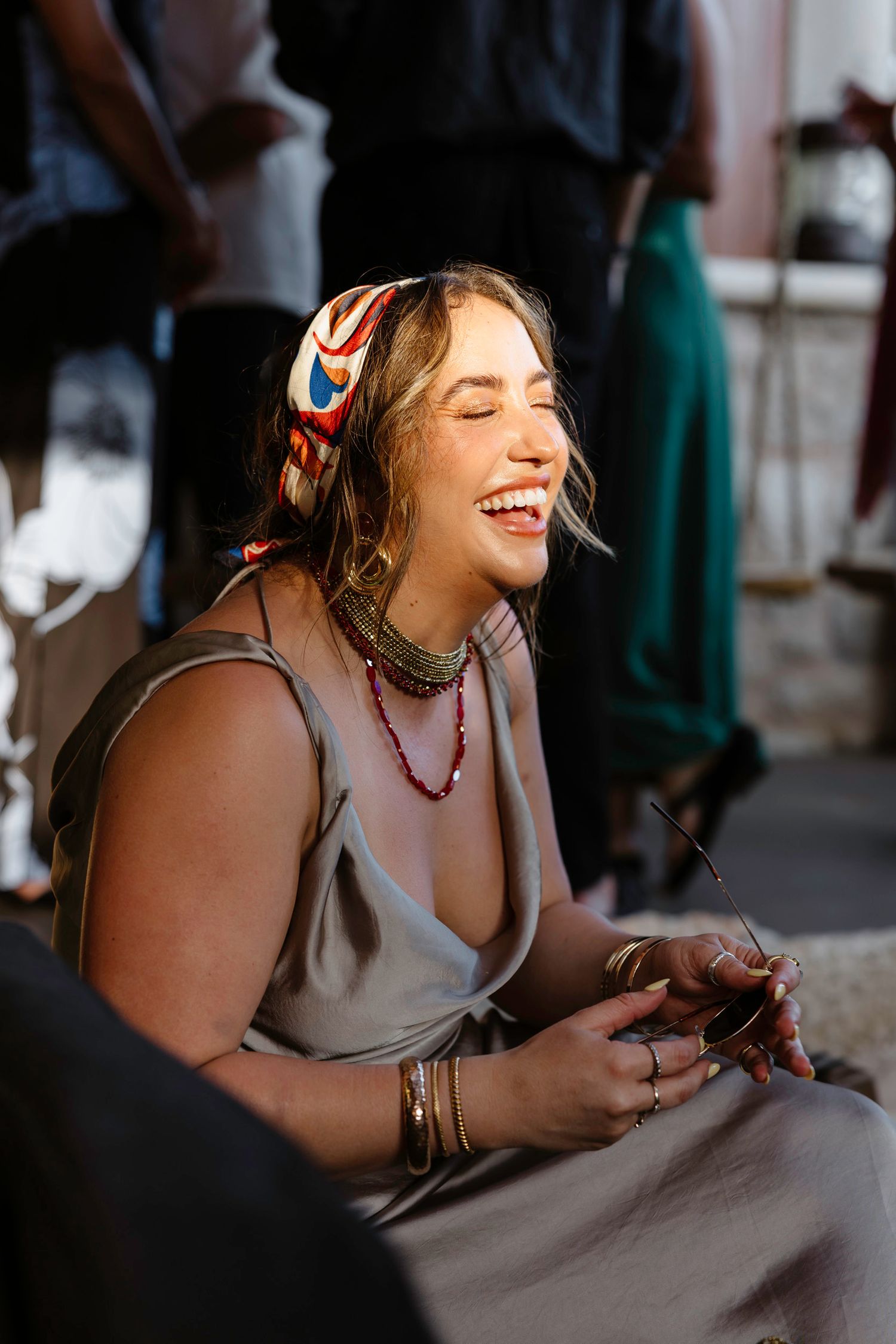Candid shots of someone laughing and enjoying themselves in natural lighting.