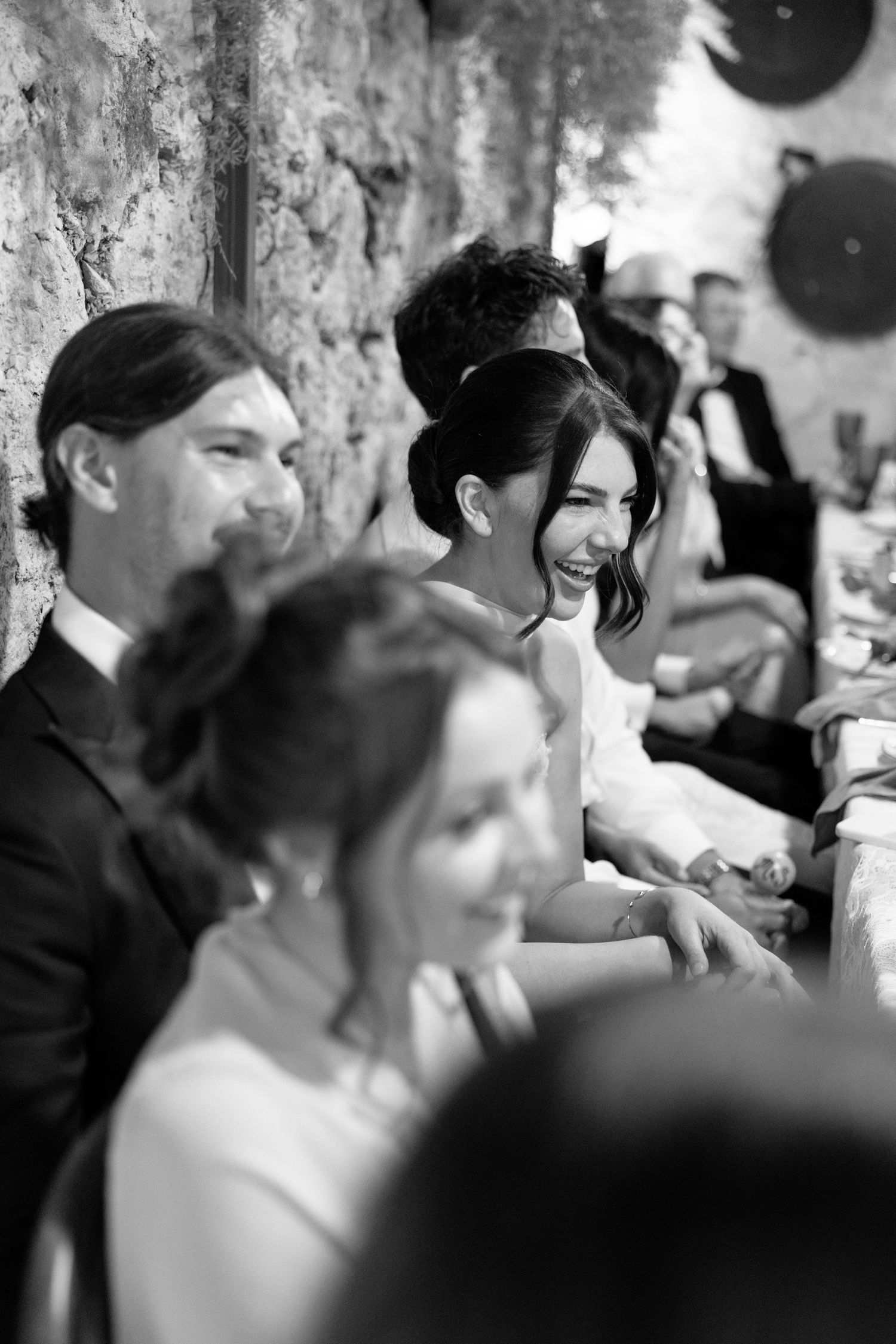 Black and white candid shots of wedding guests enjoying the celebration. Hvar, Croatia