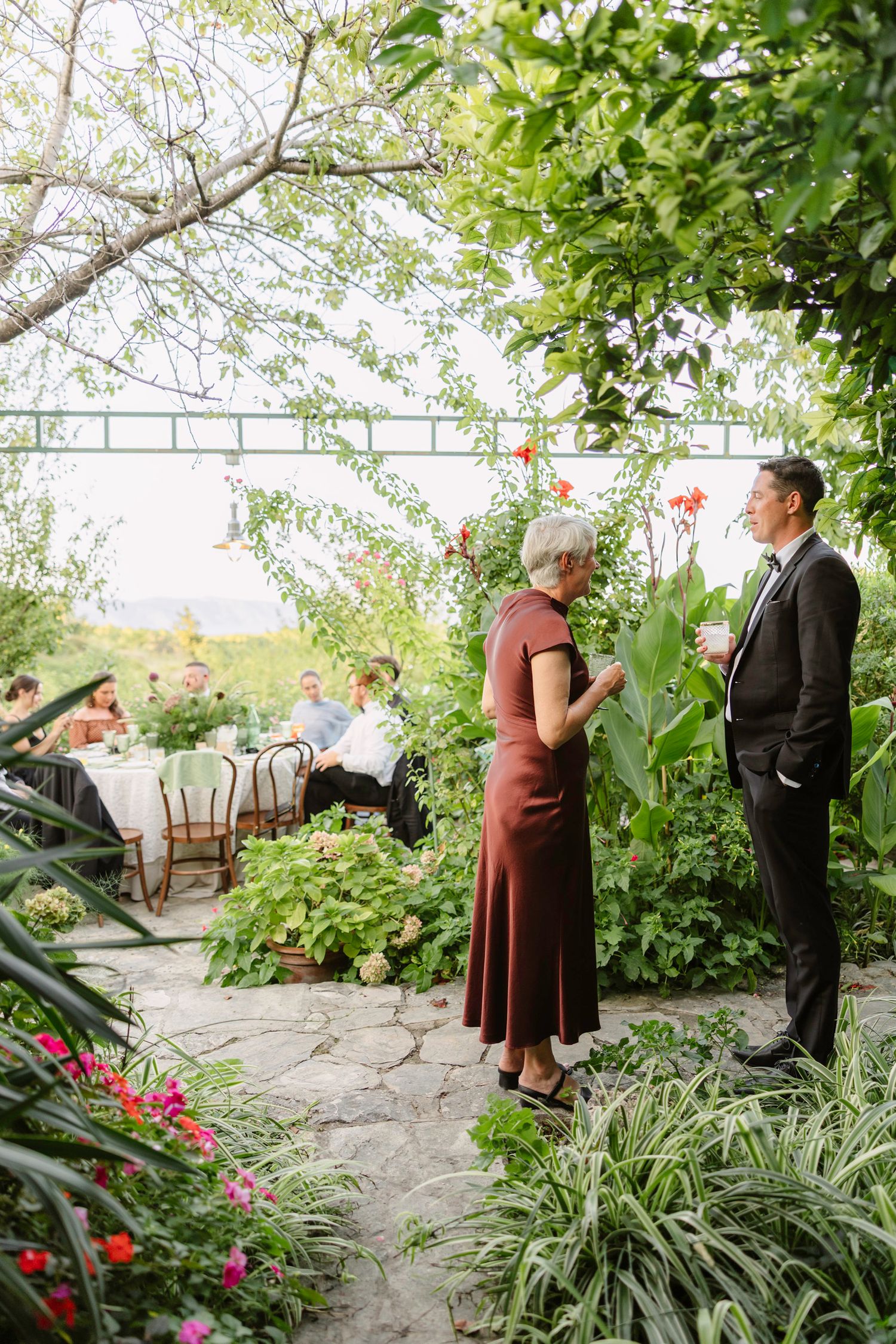Garden pathway with blooming flowers and greenery creating romantic setting. Hvar, Croatia