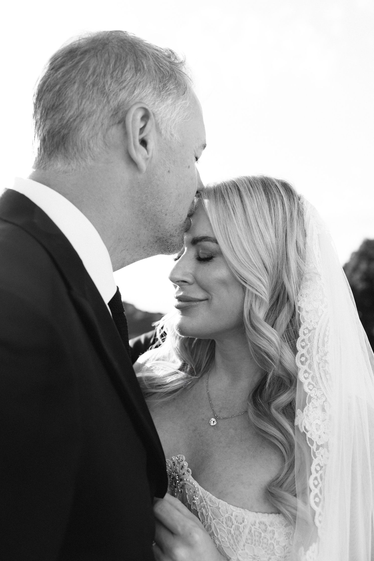 A romantic black and white wedding photo sequence showing tender moments between a bride and groom. Tuscany, Tenuta di Artimino