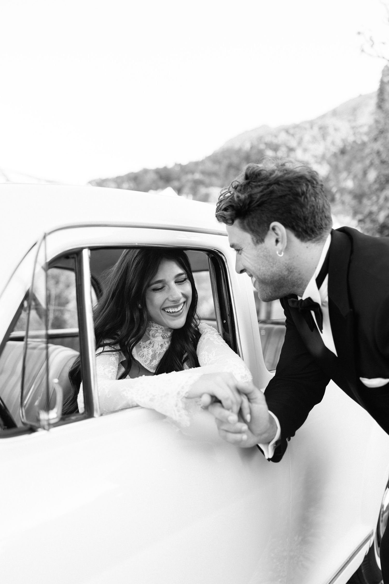 Black and white photo of a classic car moment captured through the window. Hvar, Croatia