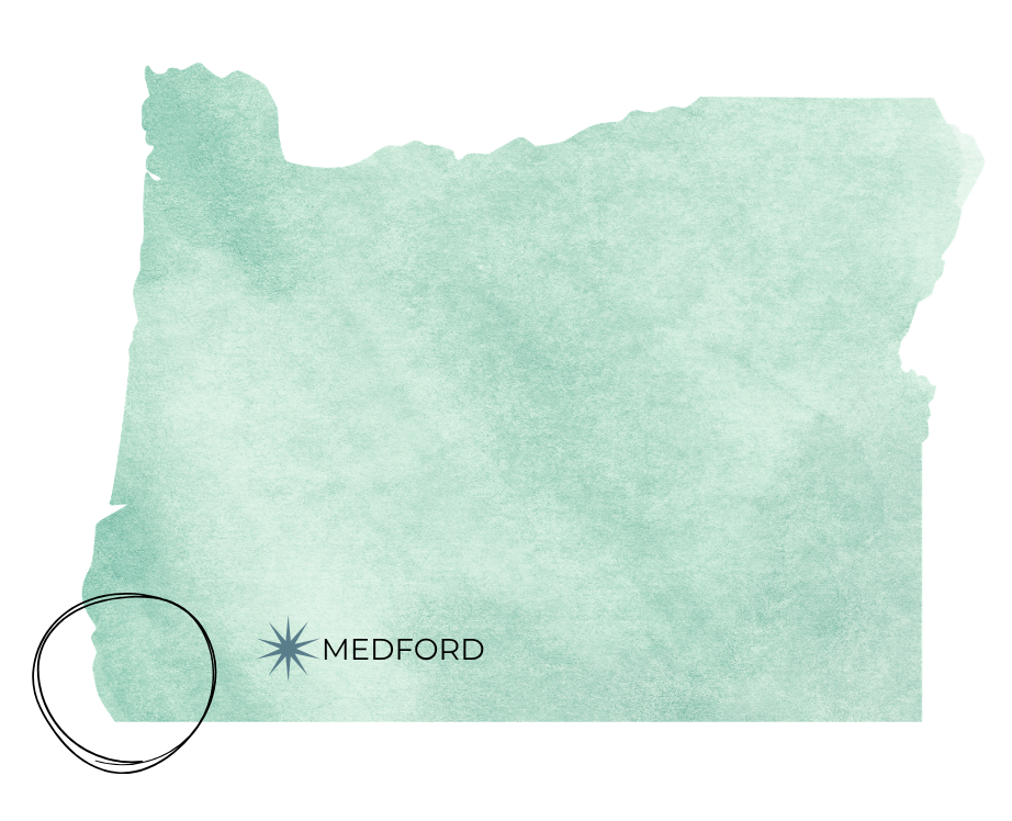 Watercolor map of Oregon state in mint green with Medford city marker indicated in the southern region.