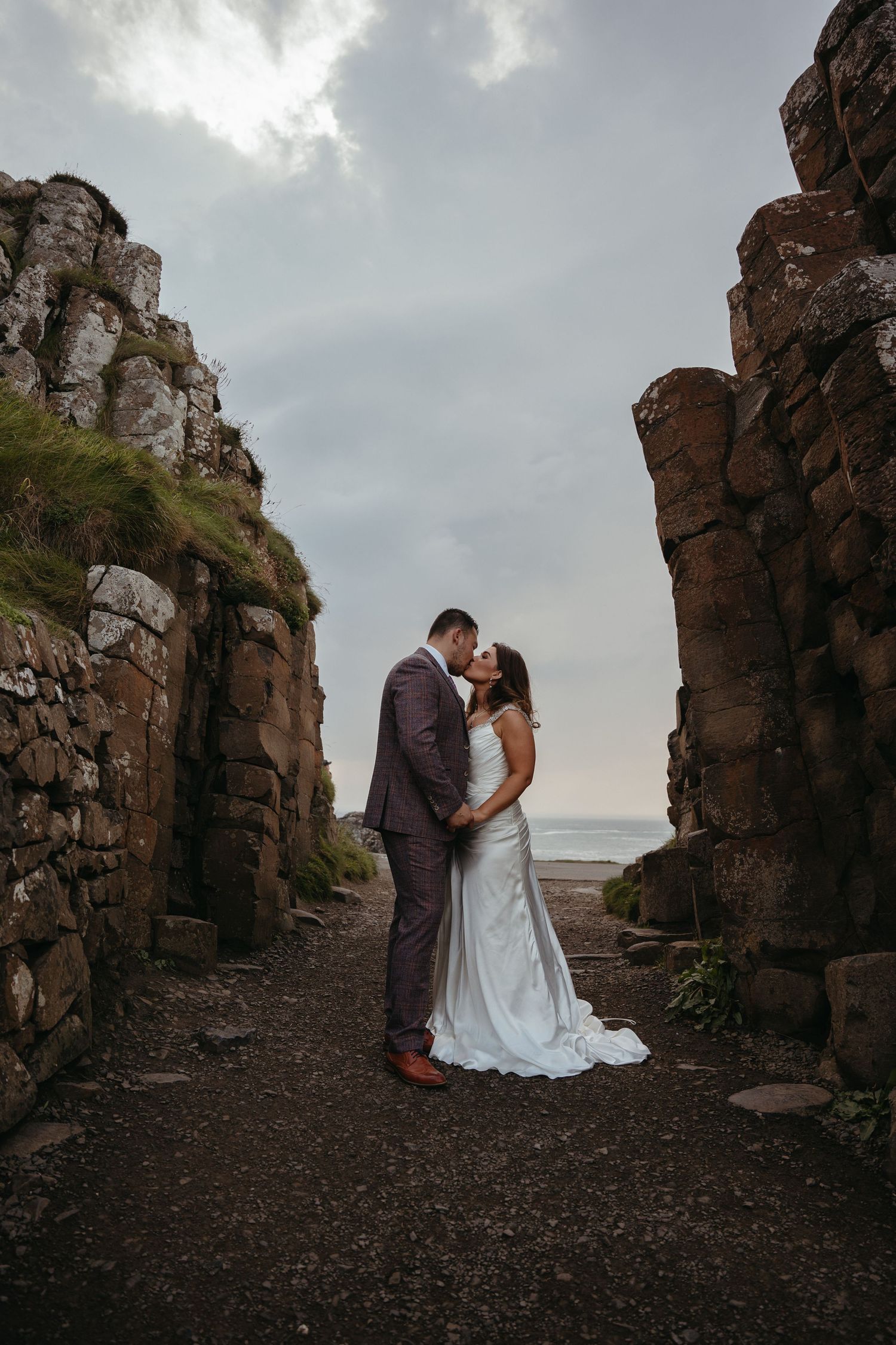 Northern Ireland adventure destination elopement at Giant's Causeway portrait between cliffs
