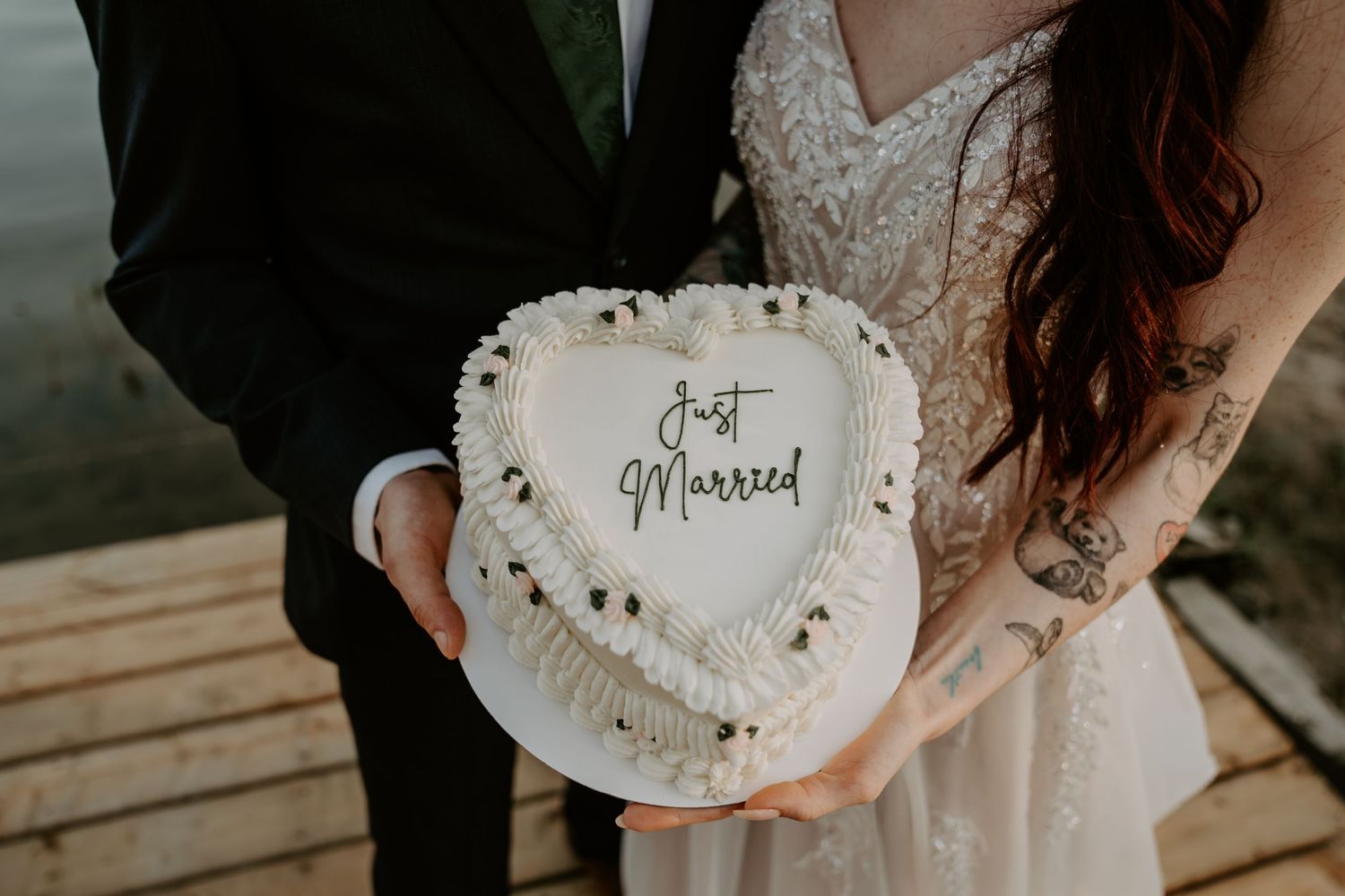 Just married couple holding their cake.