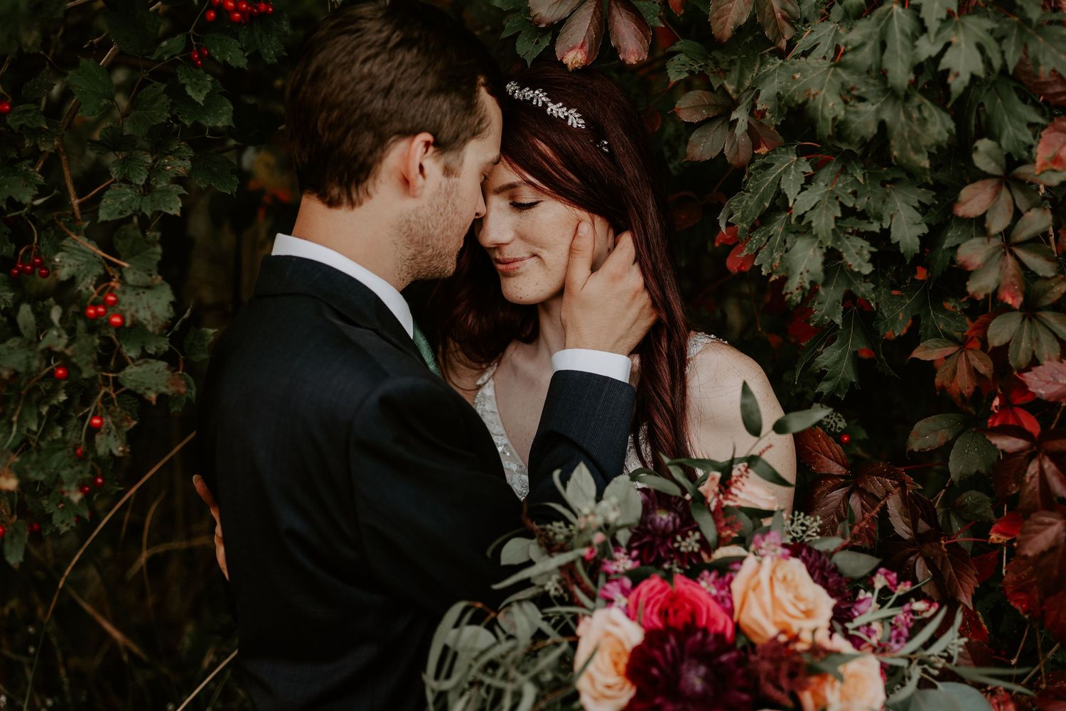 husband holds his hand to his newly wife's cheek