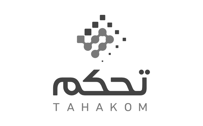 Black and white logo design for Tahakom featuring a stylized geometric pixel pattern above Arabic and English text.