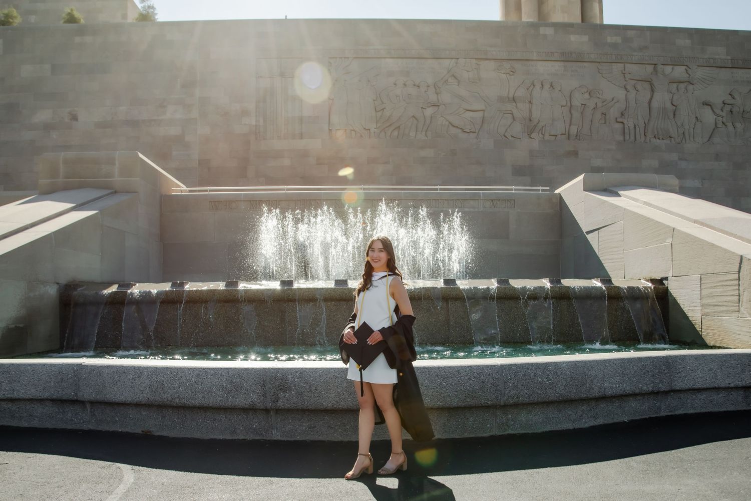A series of water features and fountains at a modern urban park with cascading pools and concrete architecture.