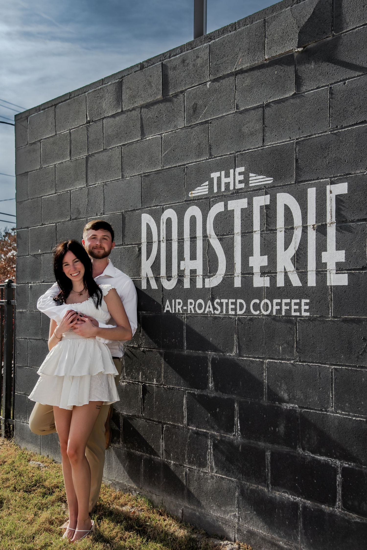 A series of outdoor photos featuring a black wall with white text advertising 'The Roasterie' coffee shop.