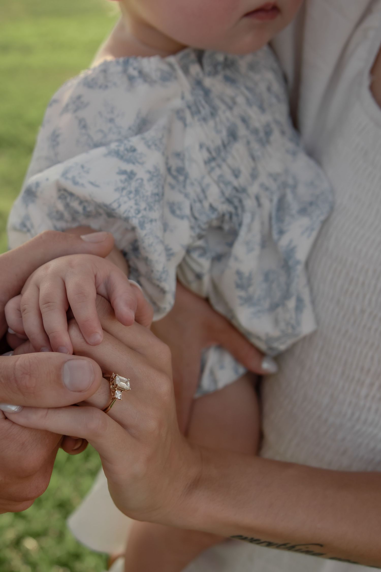 A series of close-up shots show two hands with rings joining together intimately.