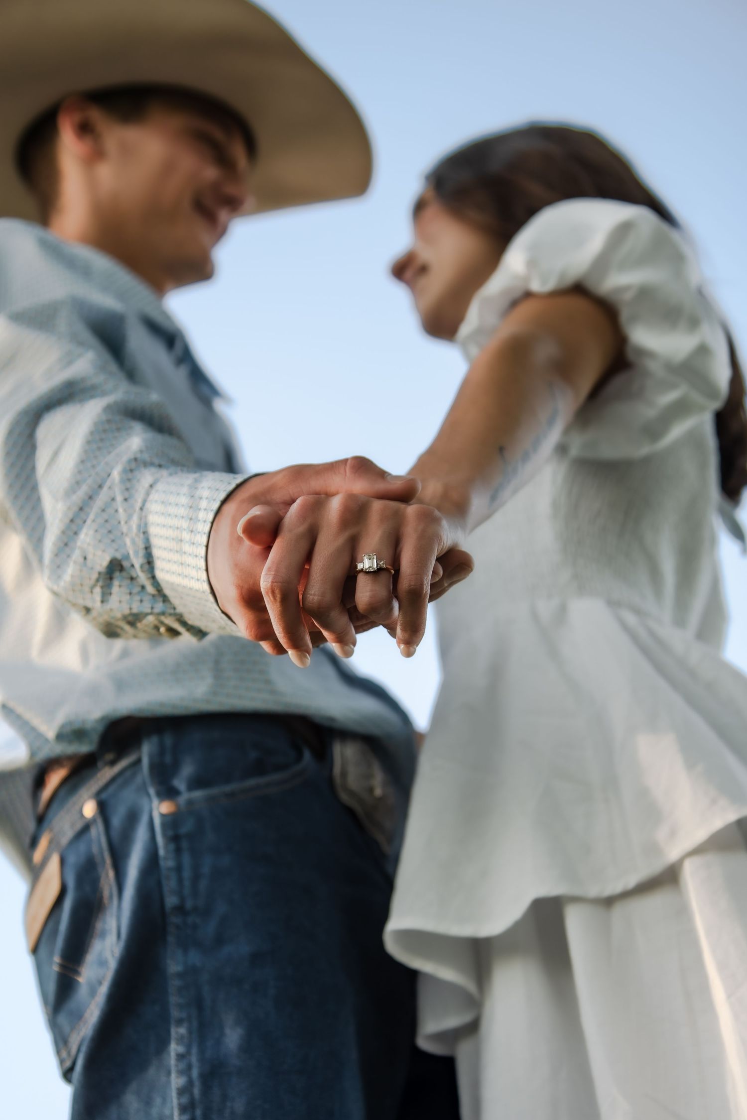 Four sequential photos showing hands pulling back a white cloth sleeve to reveal a wedding ring.