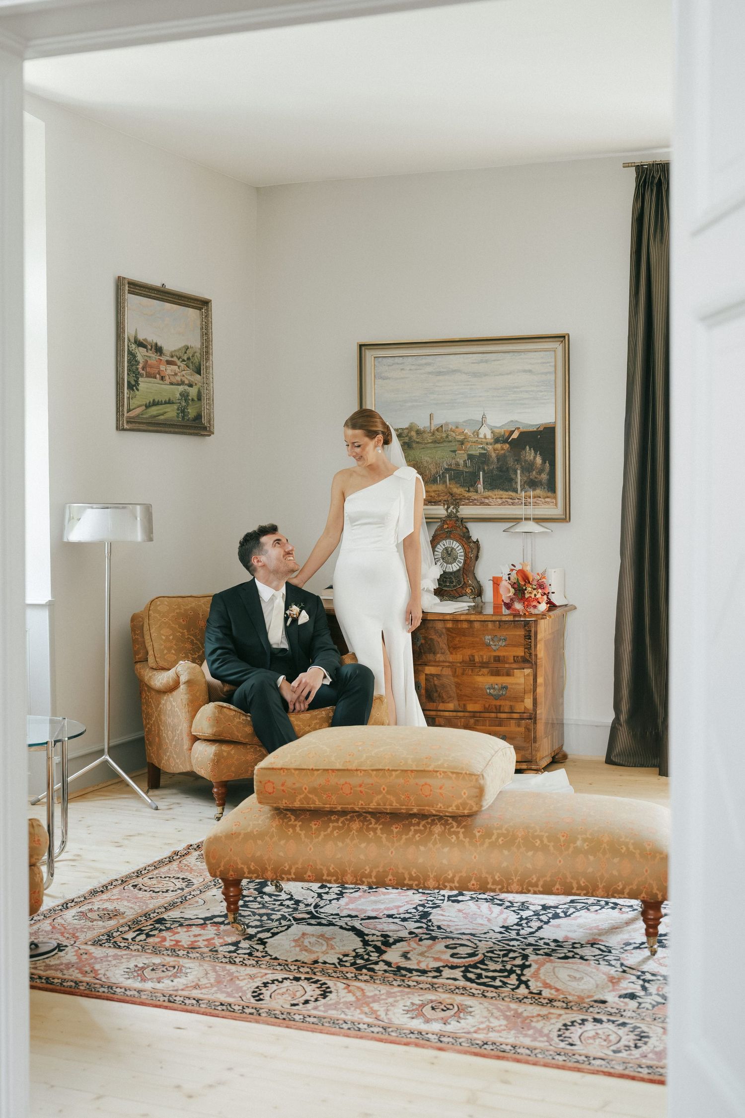 Elegant wedding photo series in a vintage room with chaise lounge and ornate decor.