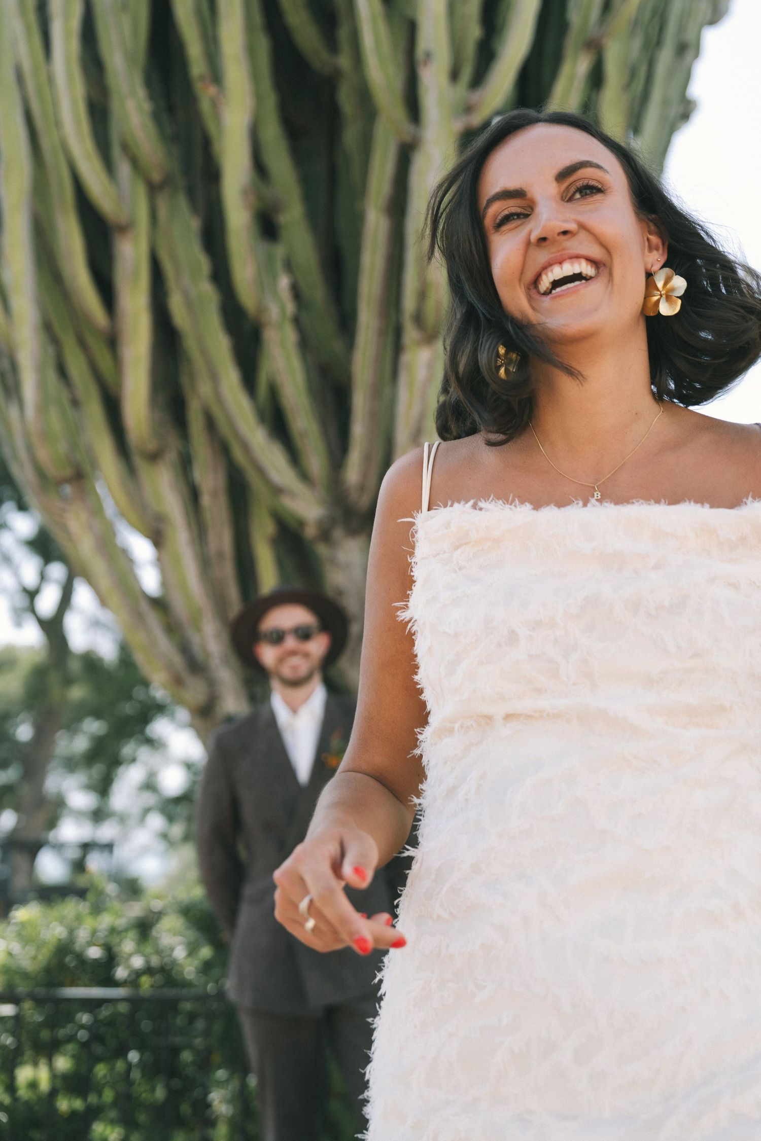 A series of joyful wedding photos showing a bride in a white textured dress against a backdrop of trees.