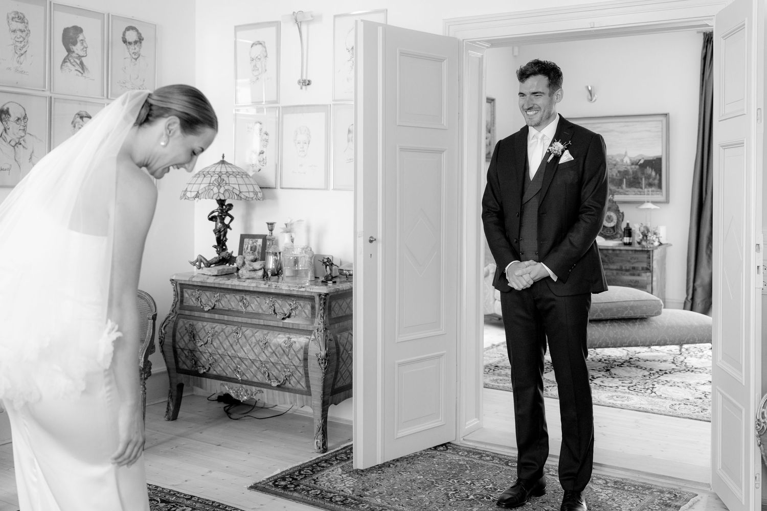 Black and white wedding day photos showing movement through elegant interior rooms.