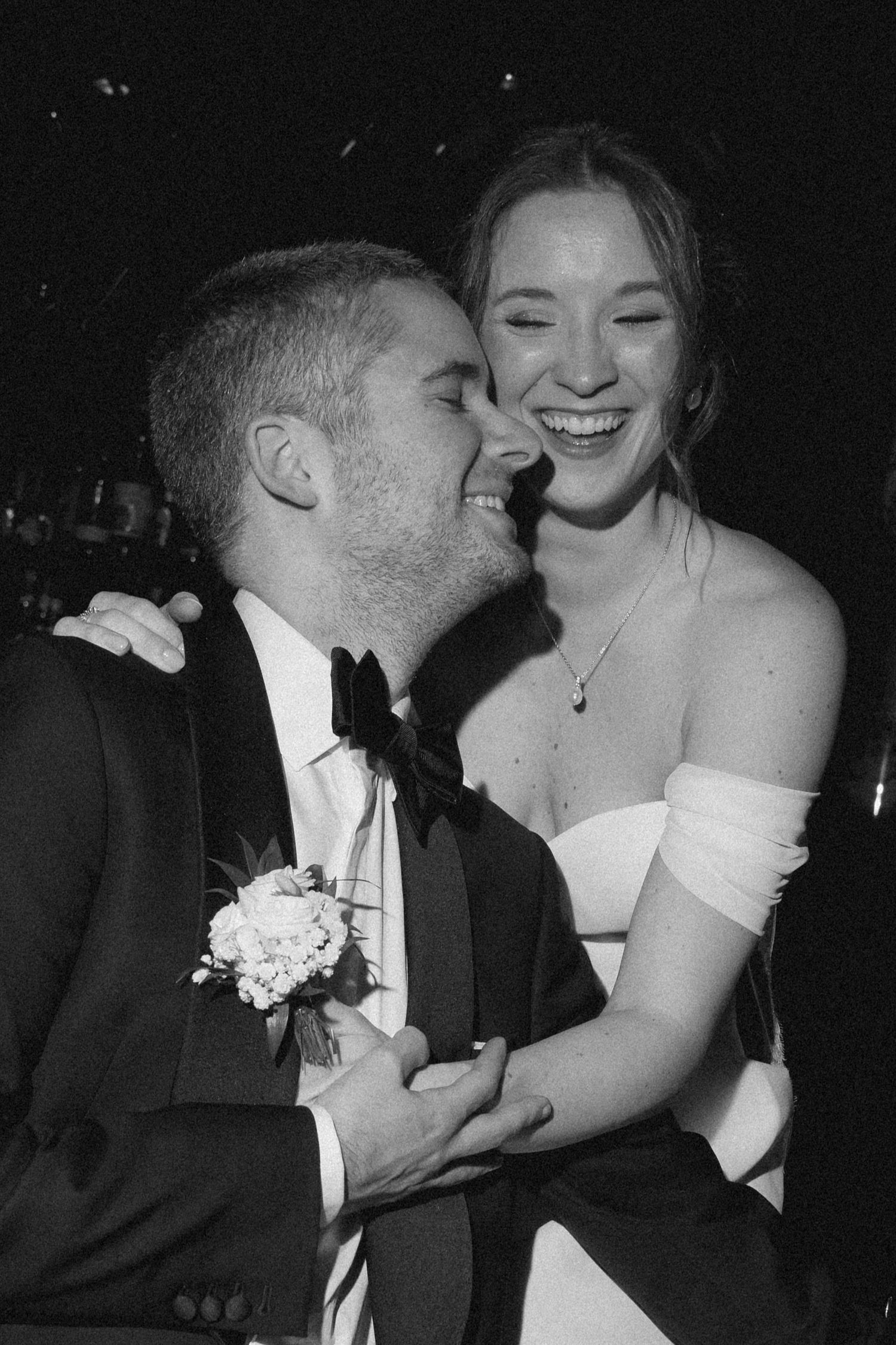 A series of intimate black and white wedding photos showing tender moments between the couple.