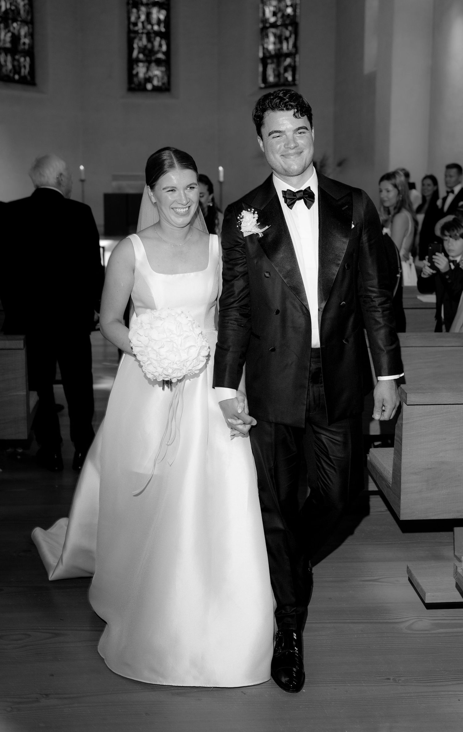 Black and white wedding photos showing couples walking down a church aisle.
