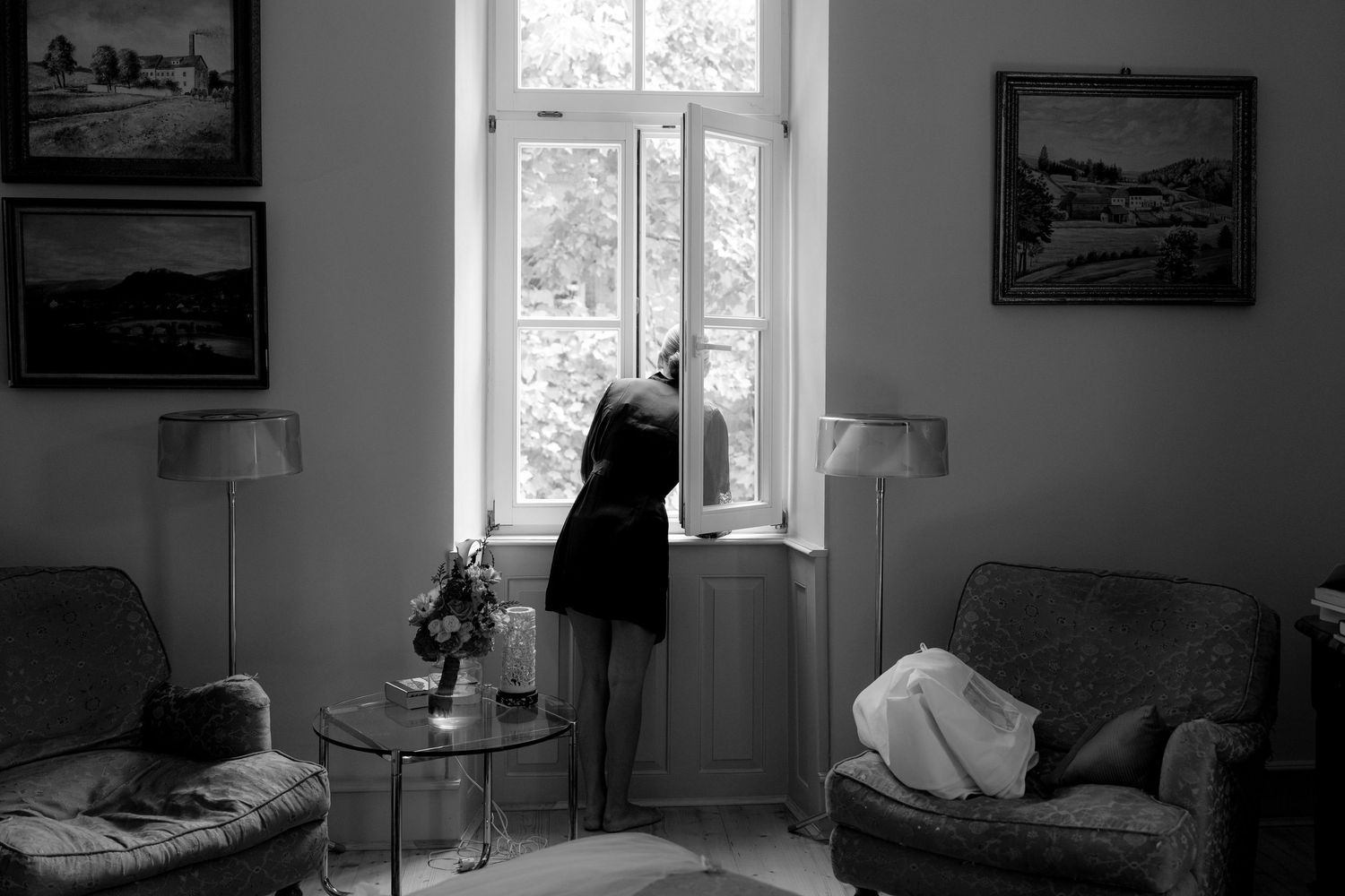 Black and white interior shots of a room with windows and vintage decor.