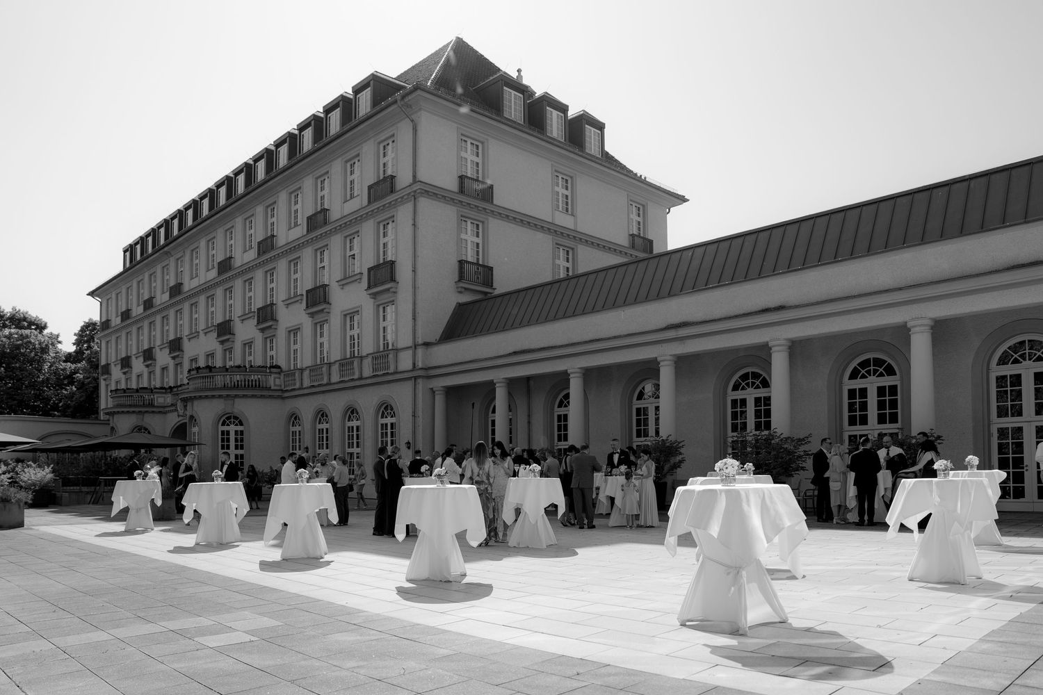 Panoramic view of a historic white building exterior with classical architecture.