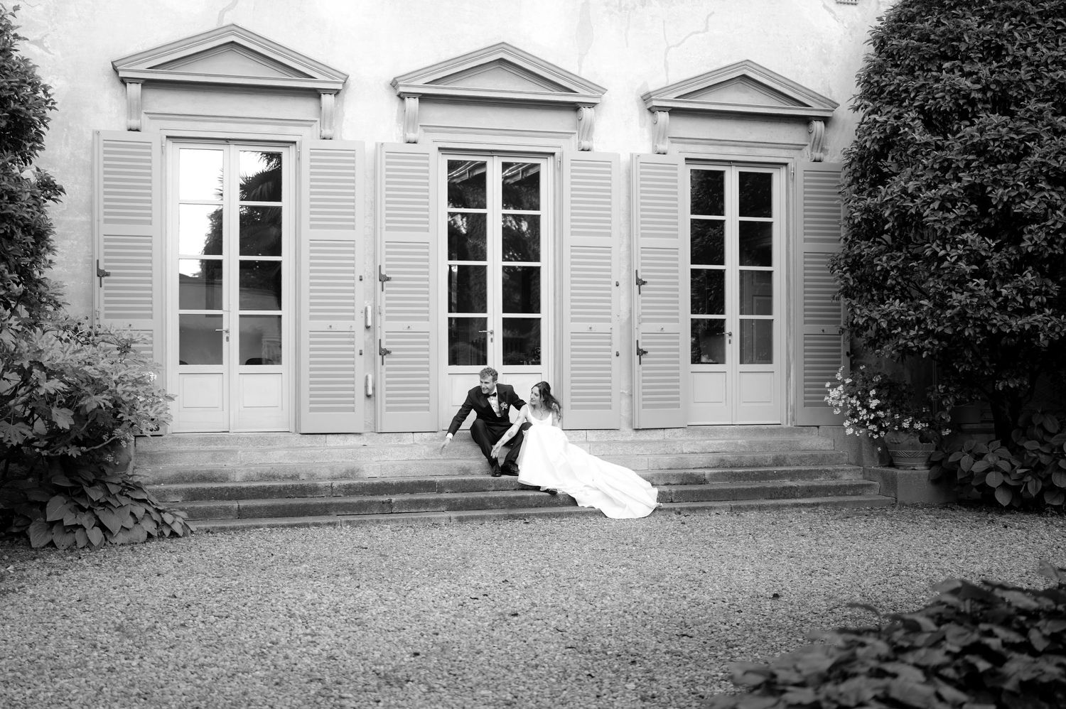 Wedding photo sequence showing couple against classic white building facade.