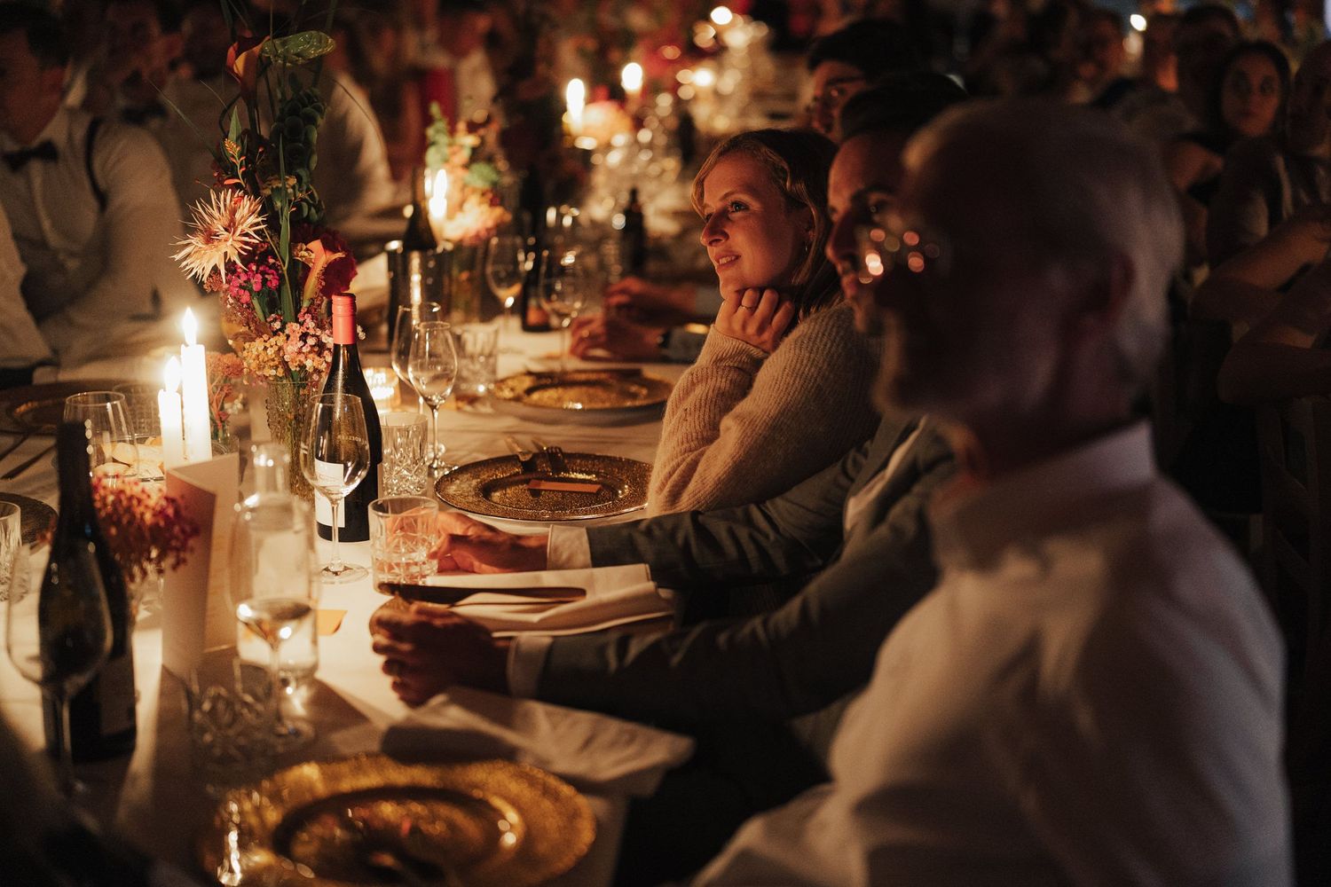 Candlelit reception tables set for an elegant evening celebration.