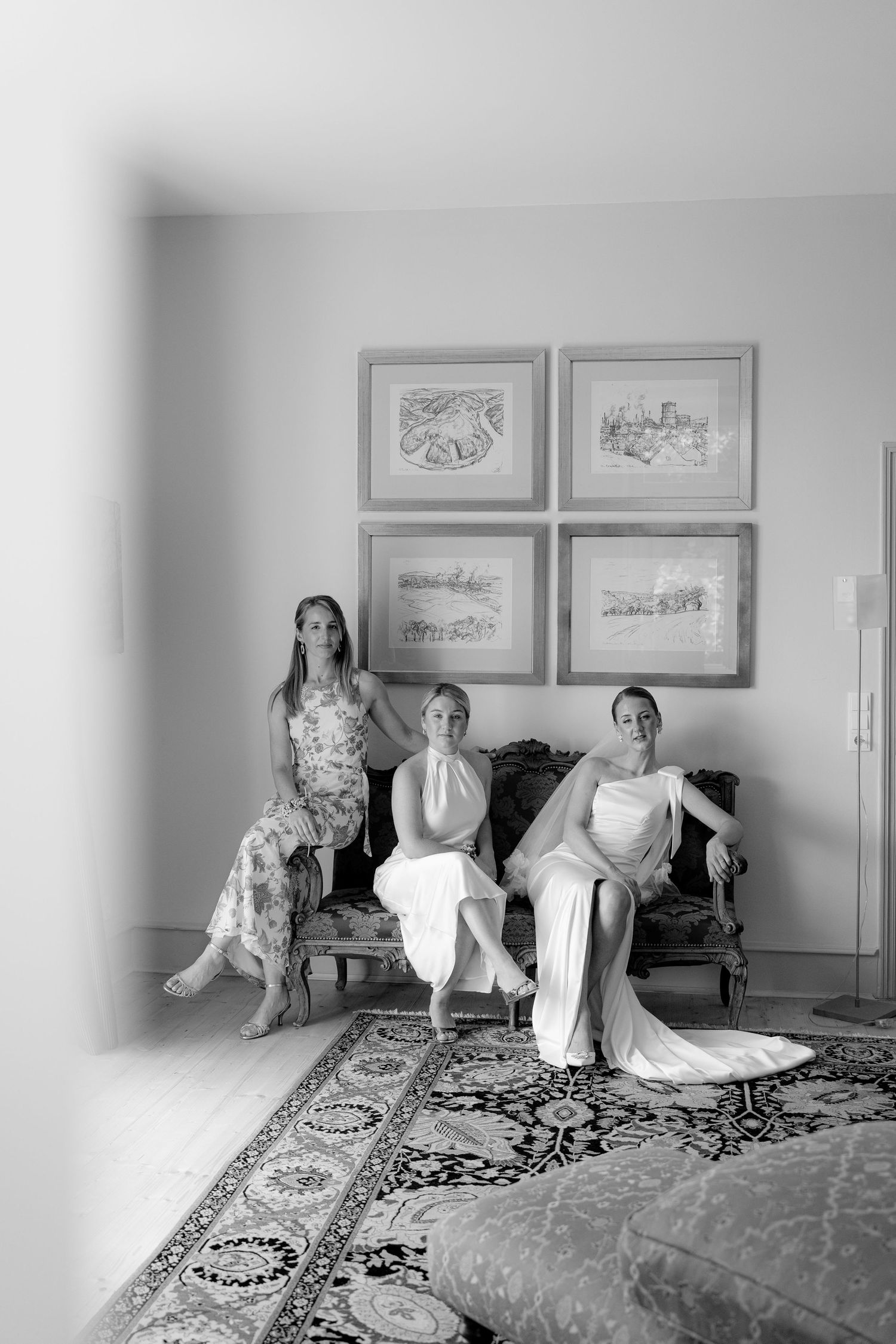 A series of black and white photos showing a person in a white dress lounging on a patterned bed.