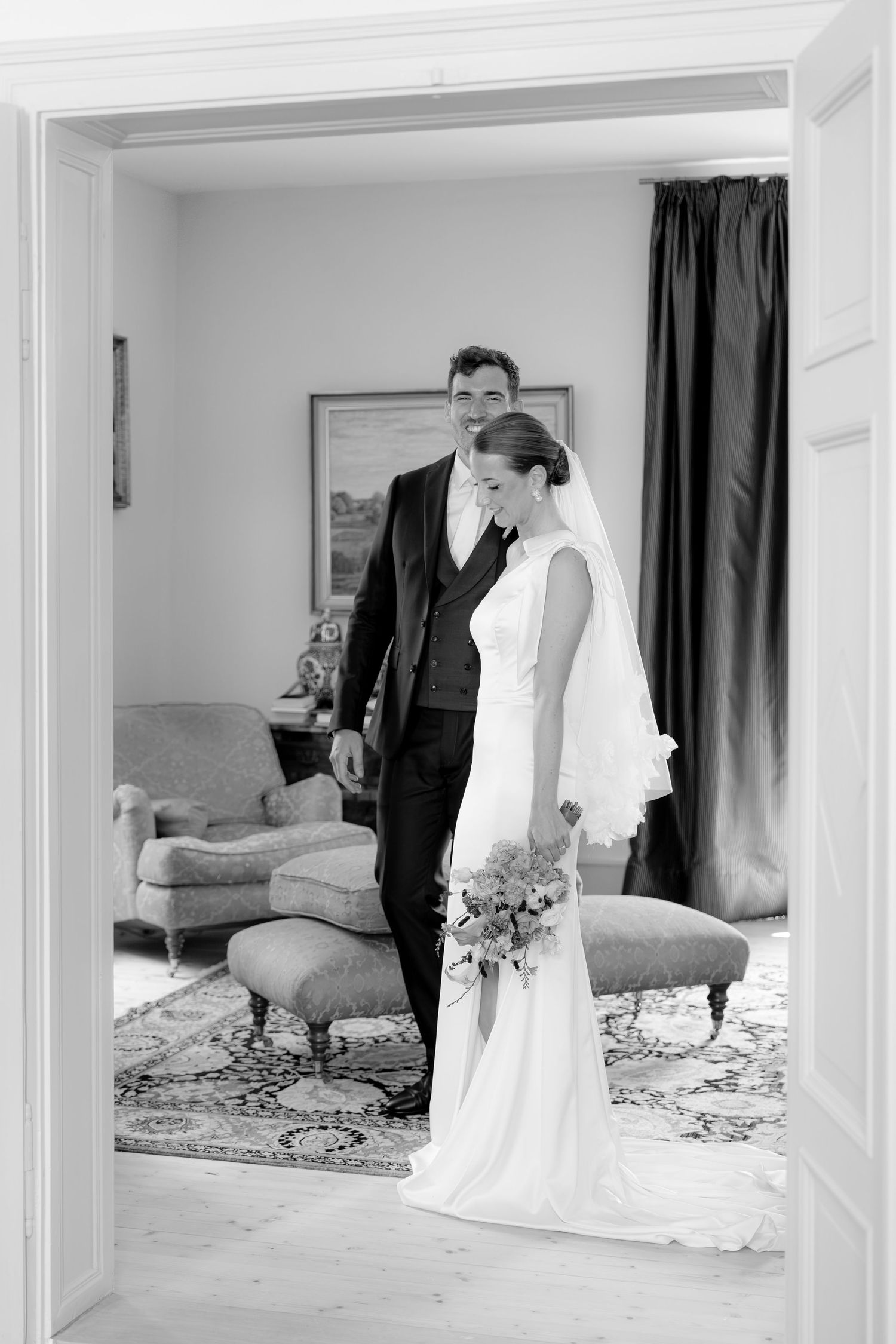 Series of wedding photos captured through doorways in an elegant interior setting.