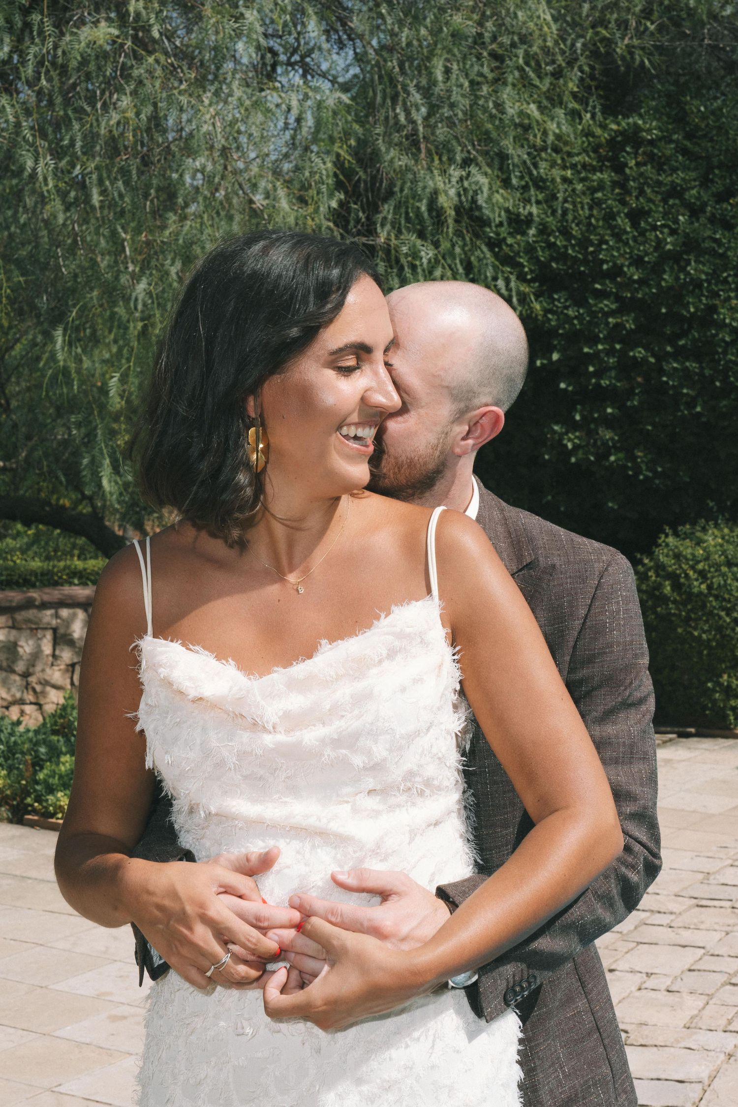A series of romantic wedding moments captured in an outdoor garden setting.