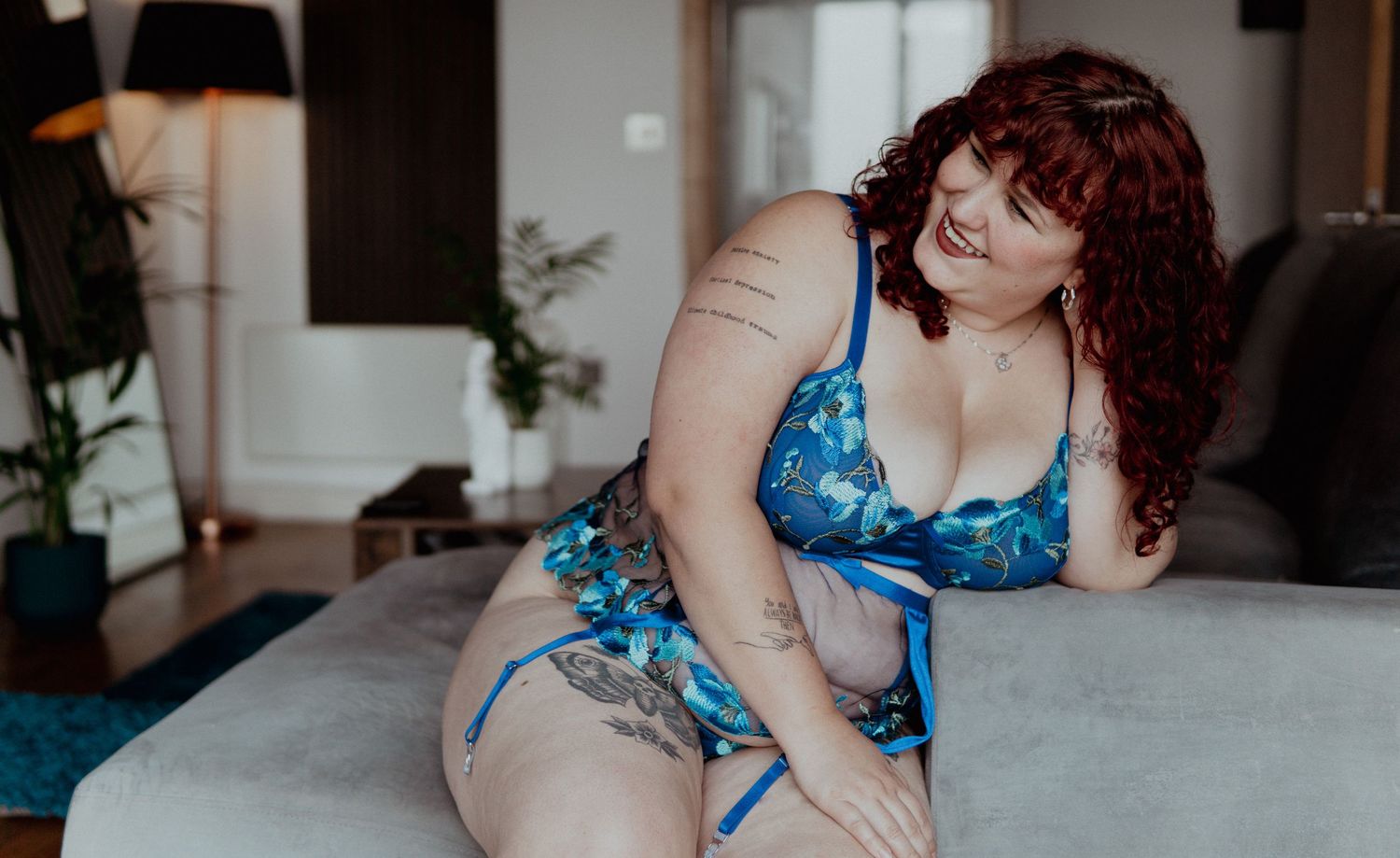 Woman with red hair wearing blue flory lingerie set  Boudoir photography UK Liverpool
