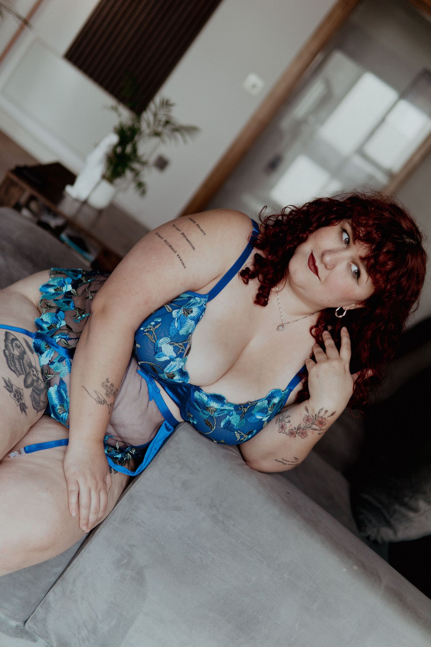 Woman with red hair wearing blue flory lingerie set  Boudoir photography UK Liverpool